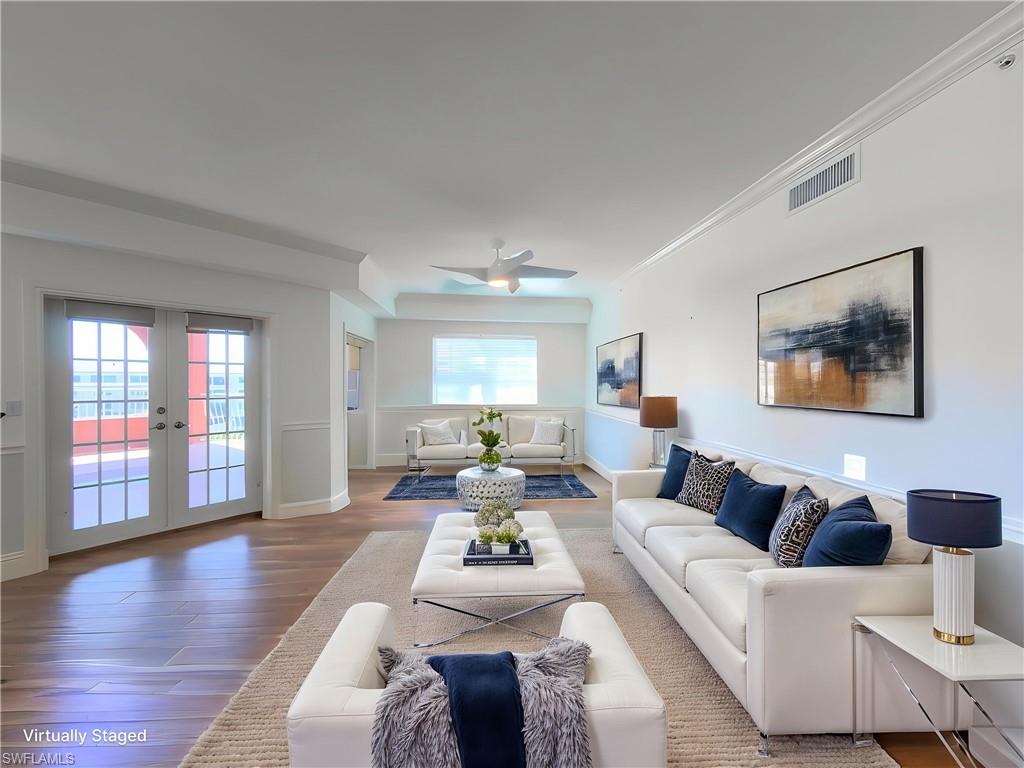 451 Bayfront Place, Unit 5407 Naples, FL 34102 - Photo 11 of 41 a living room with furniture or couch and a wooden floor