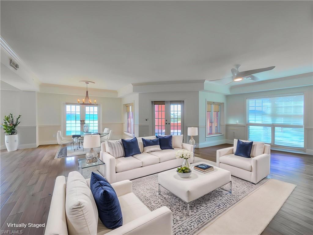 451 Bayfront Place, Unit 5407 Naples, FL 34102 - Photo 12 of 41 a living room with furniture and wooden floor
