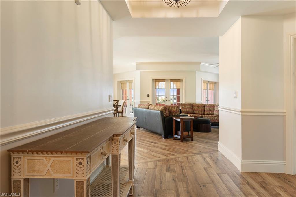 451 Bayfront Place, Unit 5407 Naples, FL 34102 - Photo 15 of 38 Corridor featuring light wood-type flooring and french doors