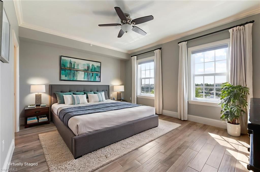 451 Bayfront Place, Unit 5407 Naples, FL 34102 - Photo 17 of 38 Bedroom featuring wood finished floors, crown molding, and ceiling fan