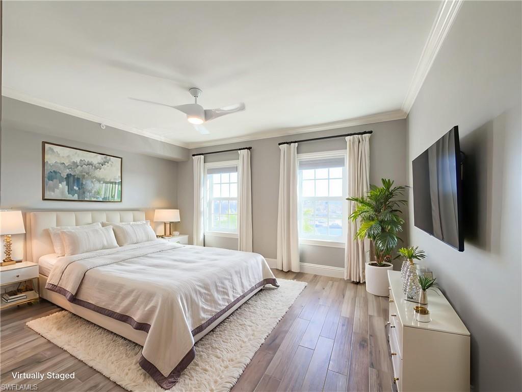 451 Bayfront Place, Unit 5407 Naples, FL 34102 - Photo 21 of 41 Bedroom featuring hardwood / wood-style floors, ornamental molding, and ceiling fan