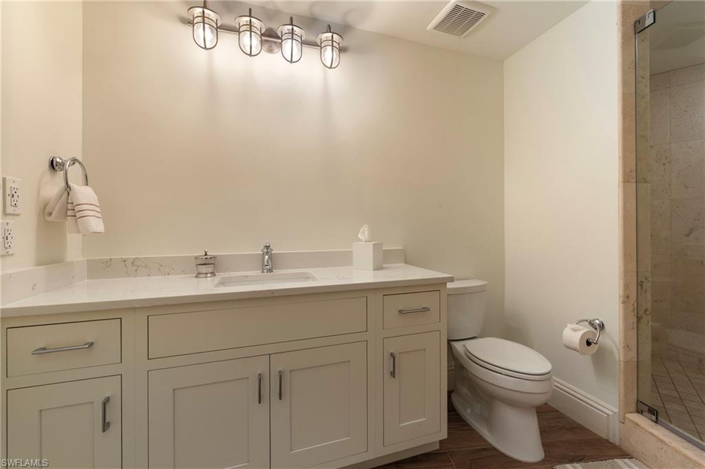 451 Bayfront Place, Unit 5407 Naples, FL 34102 - Photo 26 of 38 Bathroom with vanity and a shower stall