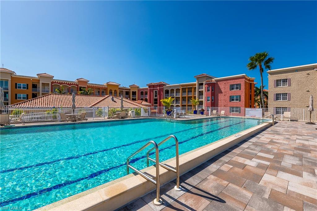 451 Bayfront Place, Unit 5407 Naples, FL 34102 - Photo 33 of 38 Community pool featuring a patio area