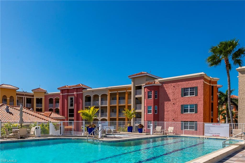 451 Bayfront Place, Unit 5407 Naples, FL 34102 - Photo 38 of 45 Community pool featuring a patio area