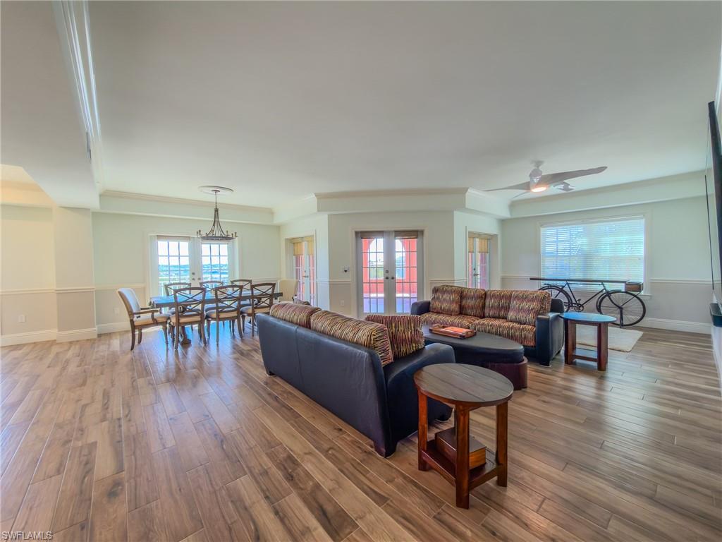 451 Bayfront Place, Unit 5407 Naples, FL 34102 - Photo 10 of 45 Living room featuring french doors, wood-type flooring, and ceiling fan