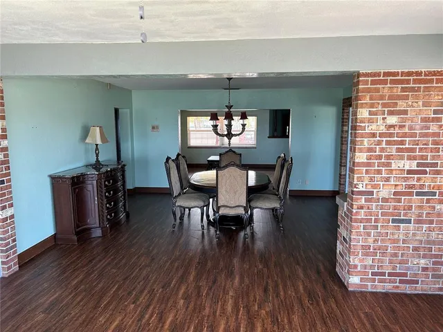 a view of a dining room with furniture and window