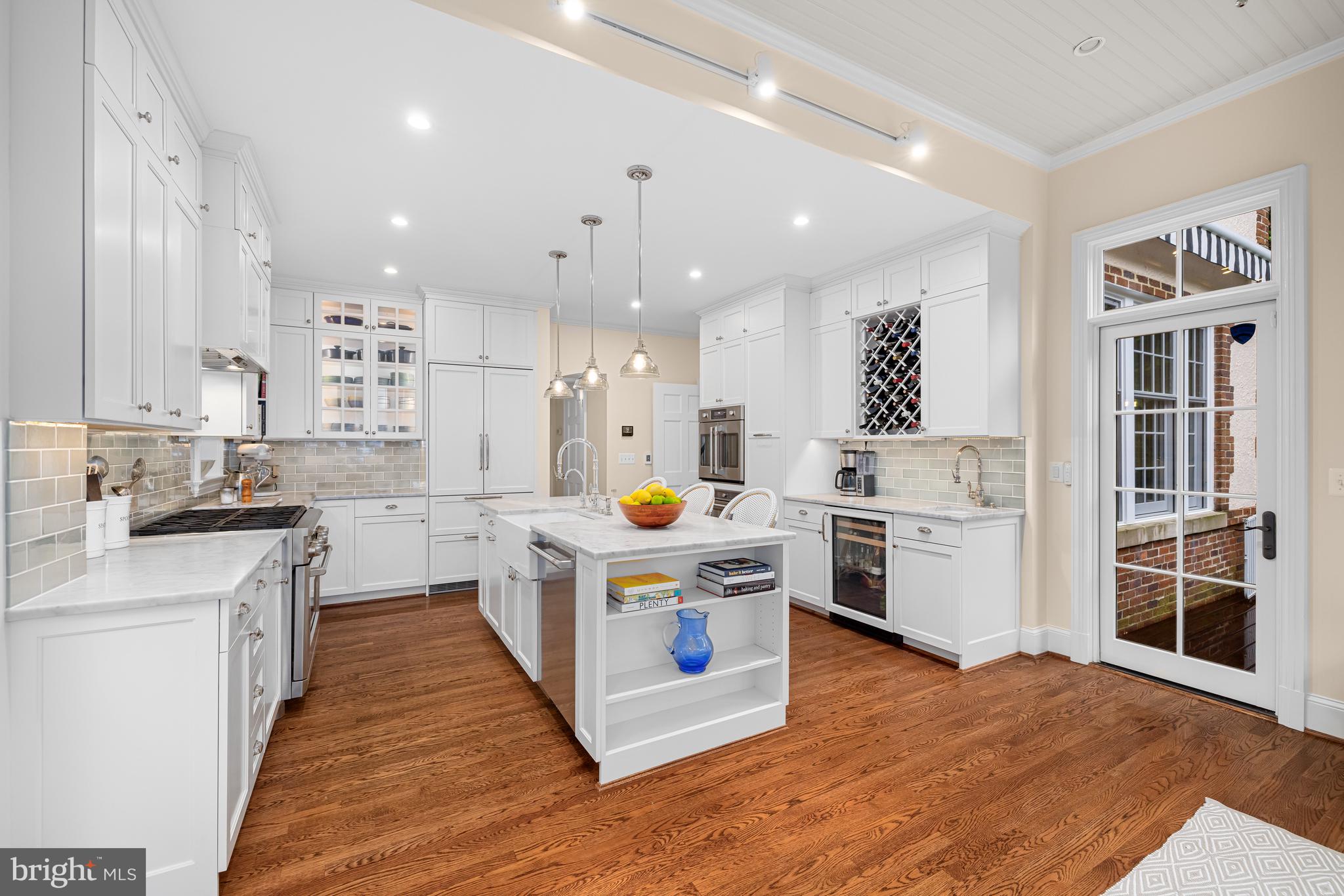 3013 Cathedral Avenue Northwest Washington, DC 20008 - Photo 12 of 33 a kitchen that has a lot of cabinets and wooden floor
