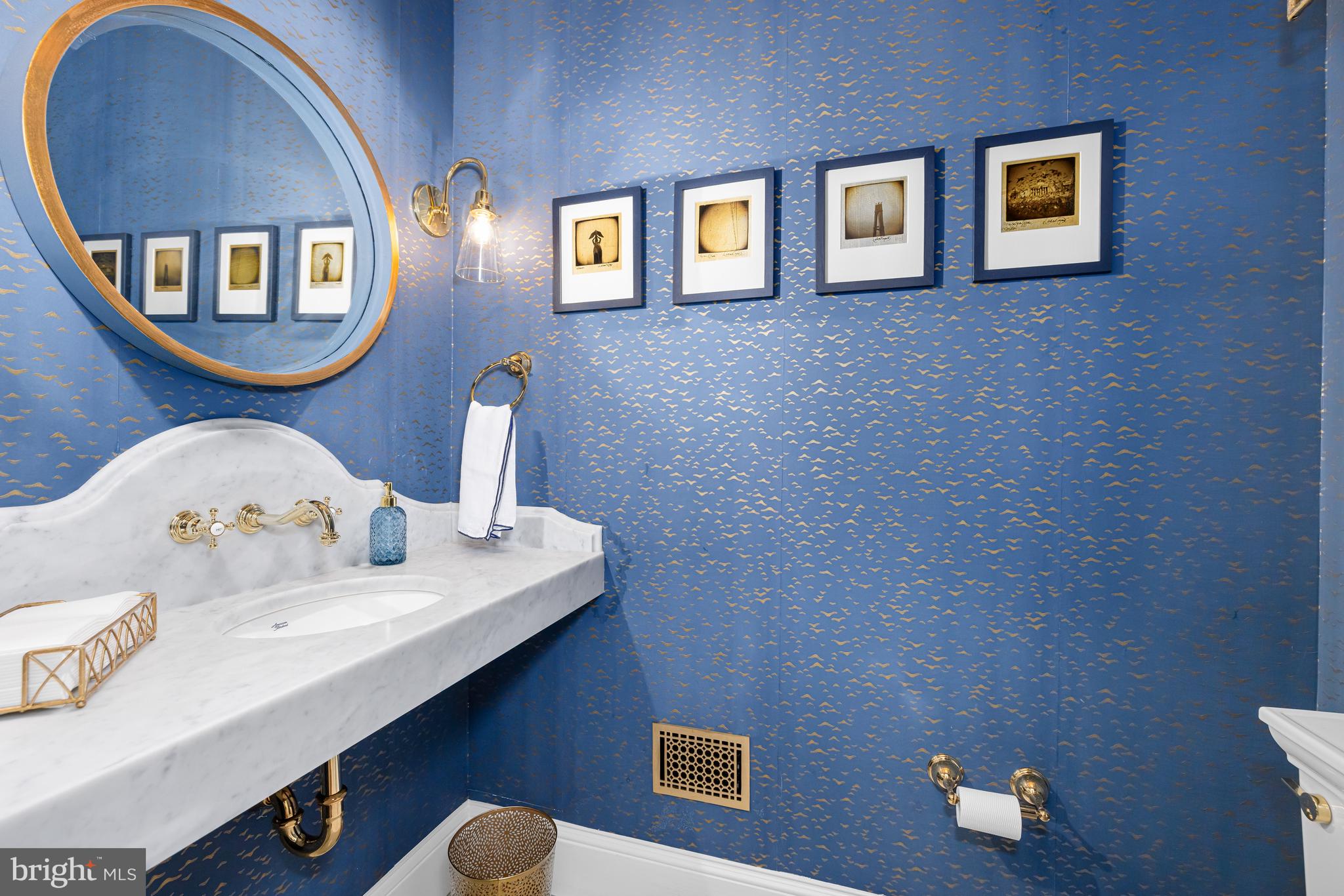 3013 Cathedral Avenue Northwest Washington, DC 20008 - Photo 14 of 33 a bathroom with a sink and a mirror
