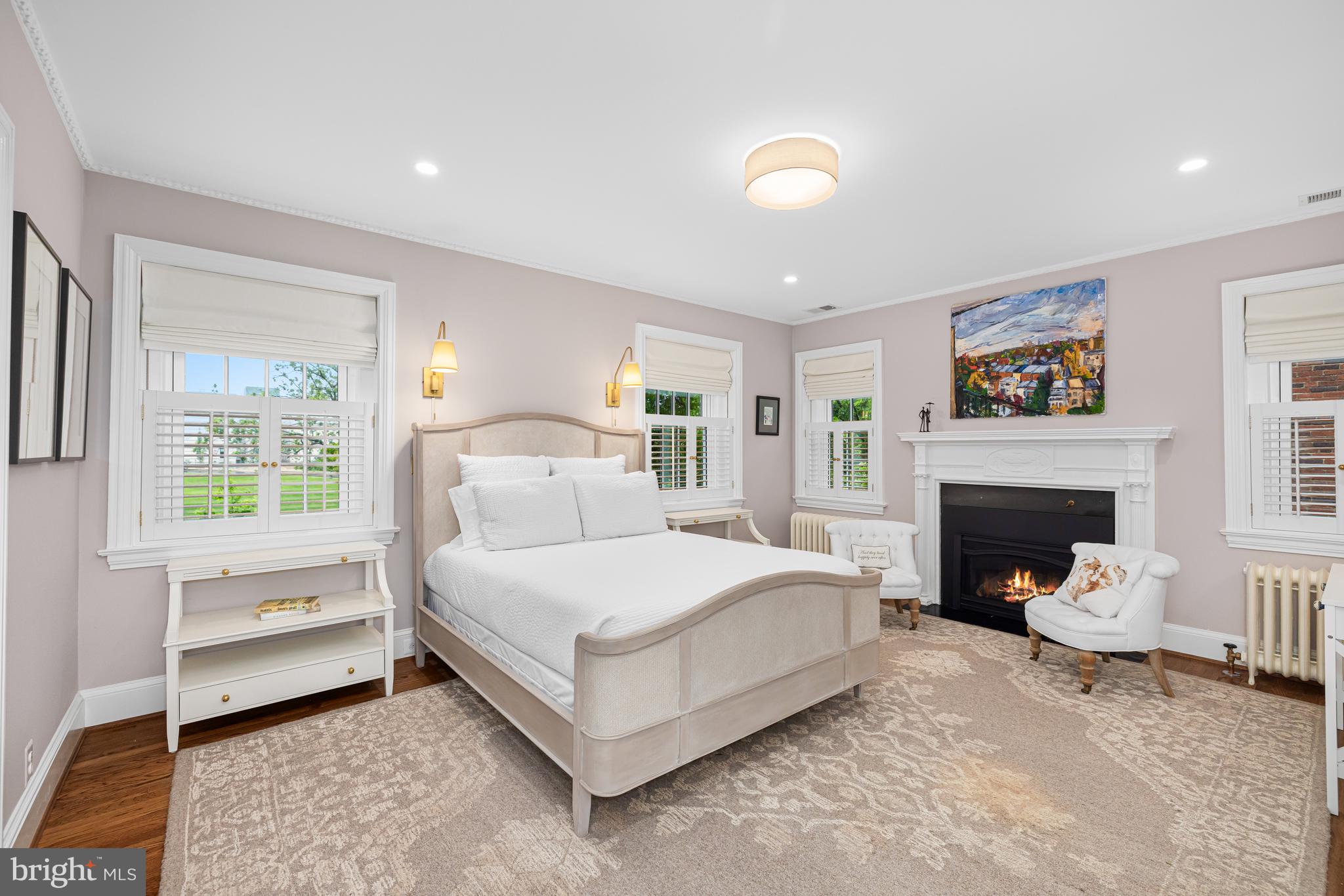 3013 Cathedral Avenue Northwest Washington, DC 20008 - Photo 17 of 33 a bed room with a bed and a fireplace