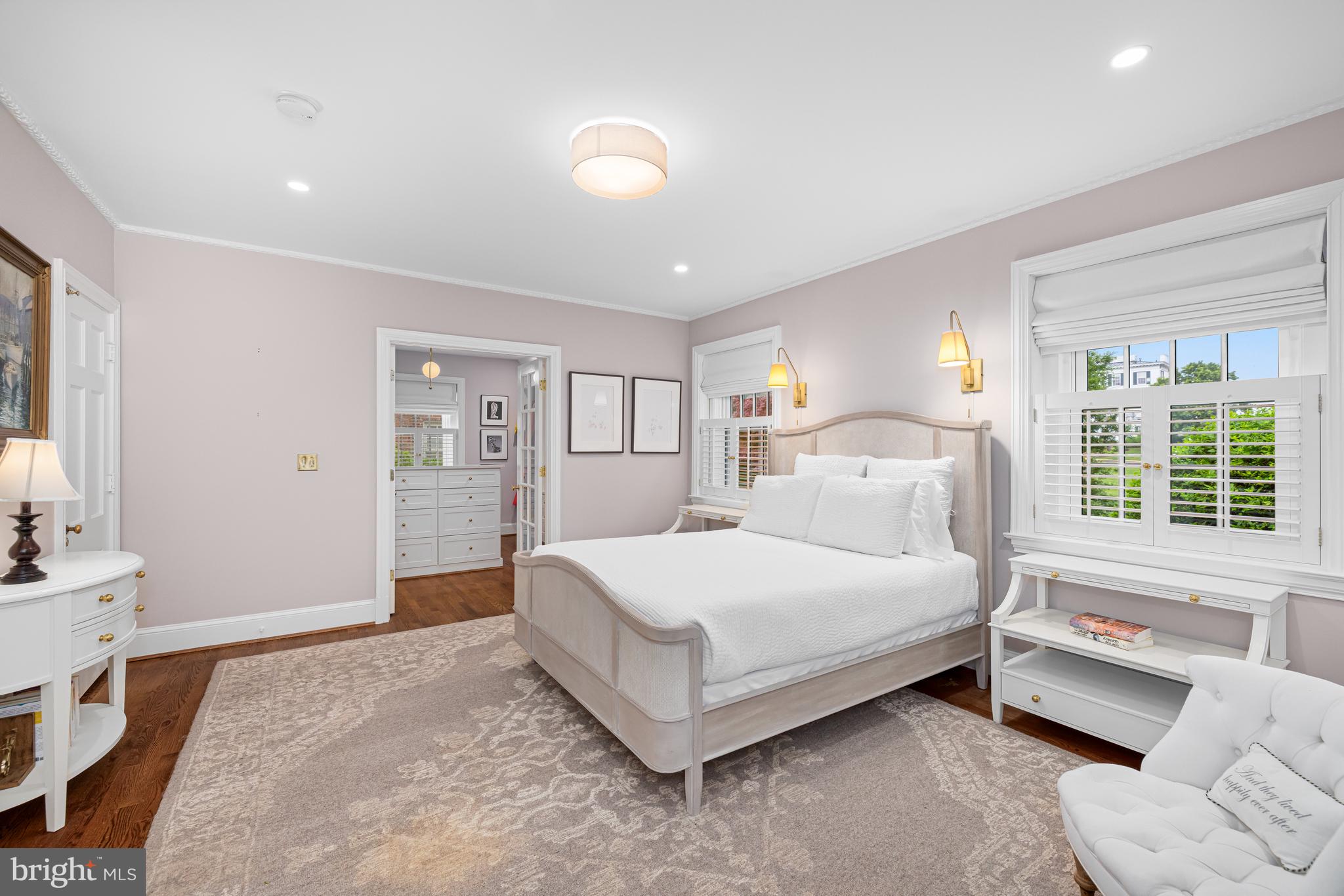 3013 Cathedral Avenue Northwest Washington, DC 20008 - Photo 18 of 33 a spacious bedroom with a bed a couch and large window