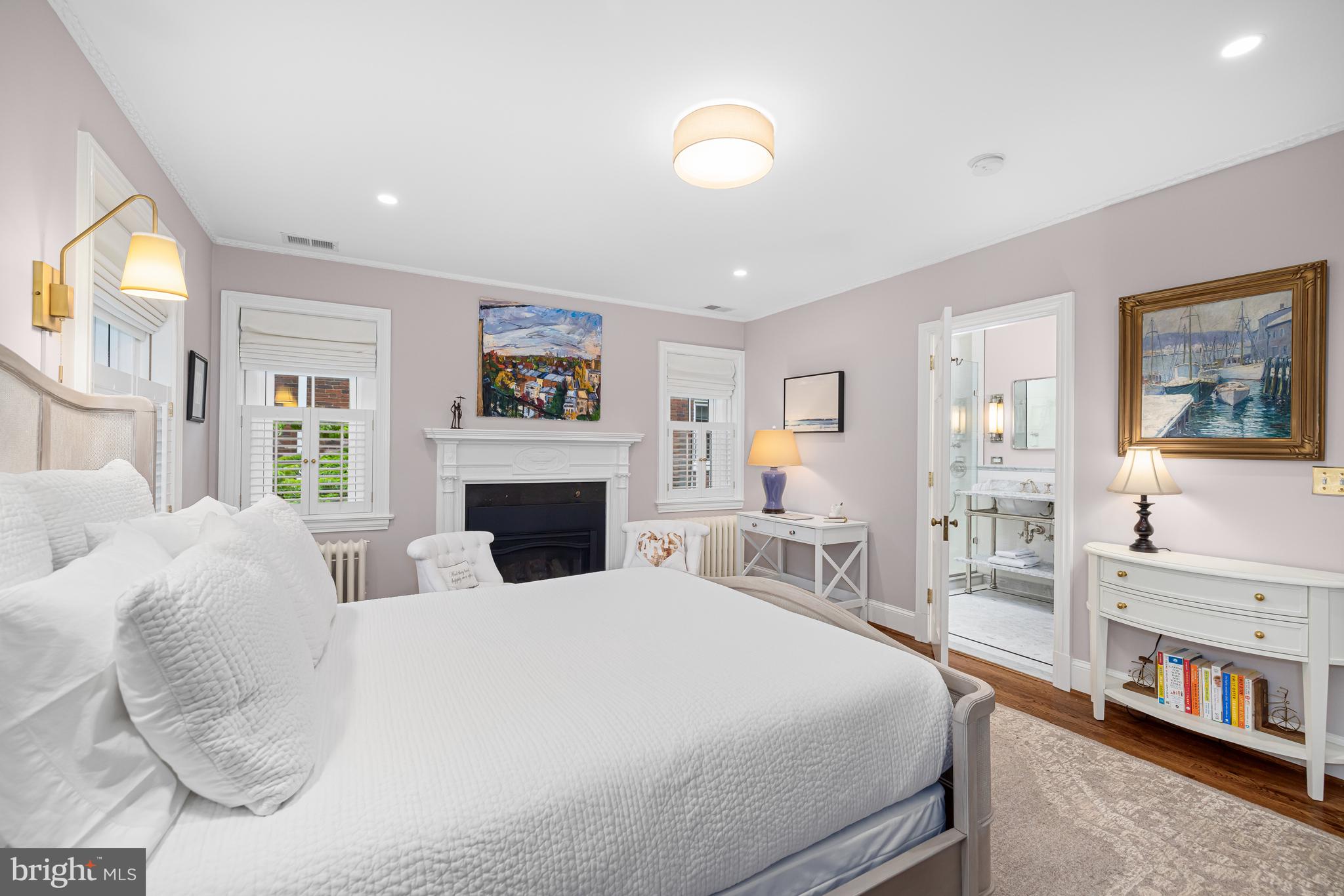 3013 Cathedral Avenue Northwest Washington, DC 20008 - Photo 19 of 33 a large bedroom with a large bed and a flat tv screen
