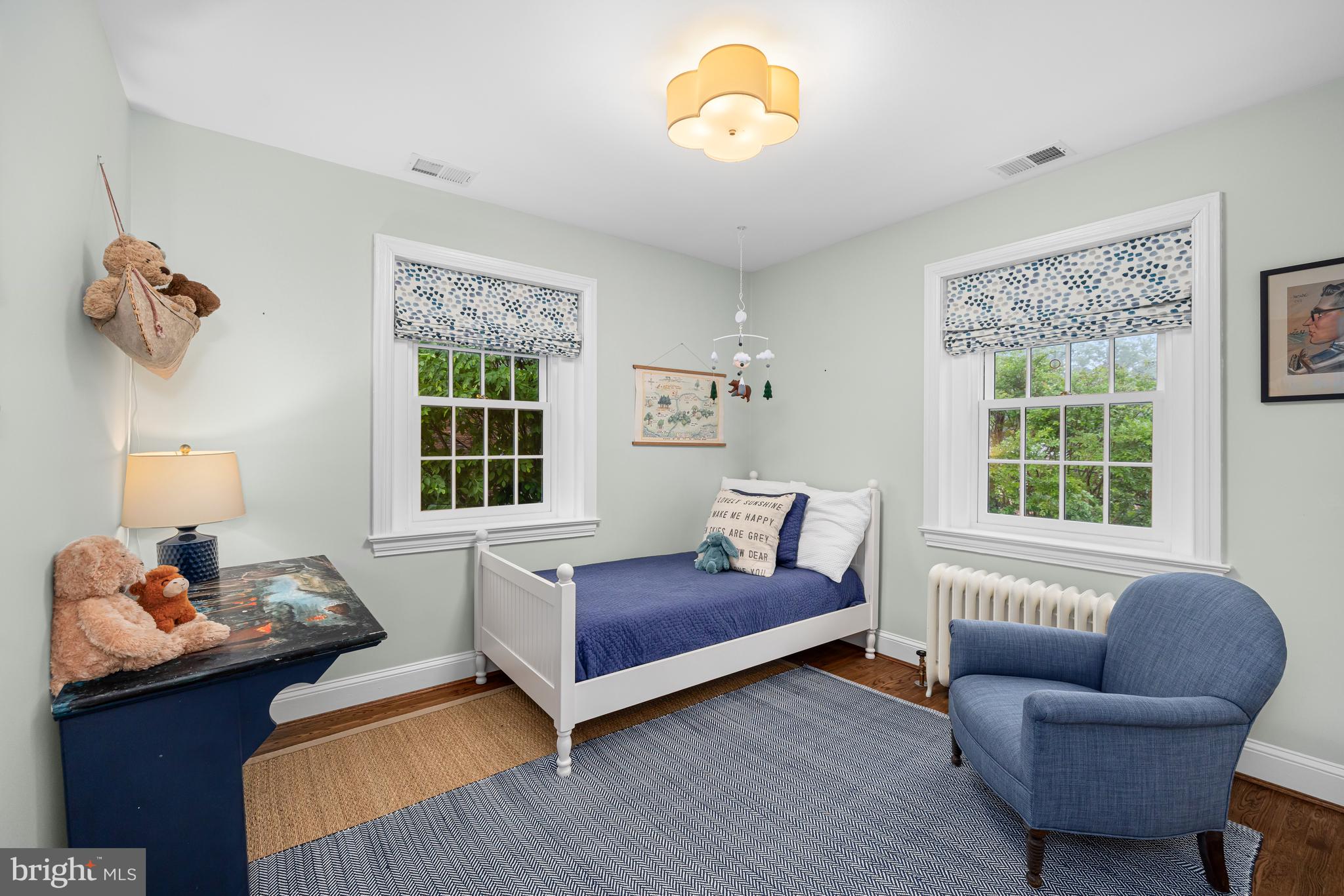 3013 Cathedral Avenue Northwest Washington, DC 20008 - Photo 23 of 33 a bedroom with furniture and a window