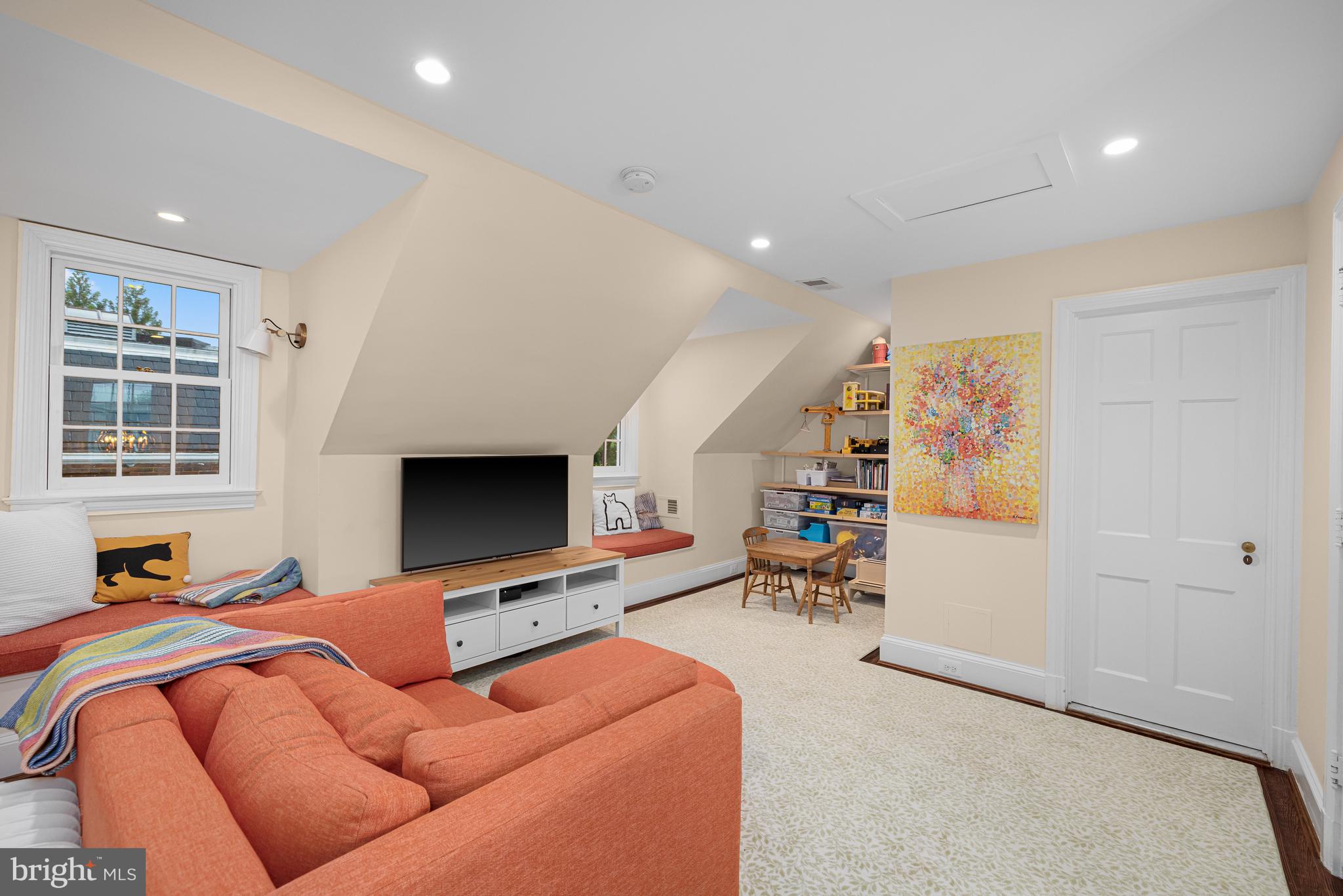 3013 Cathedral Avenue Northwest Washington, DC 20008 - Photo 27 of 33 a bedroom with furniture and a flat screen tv