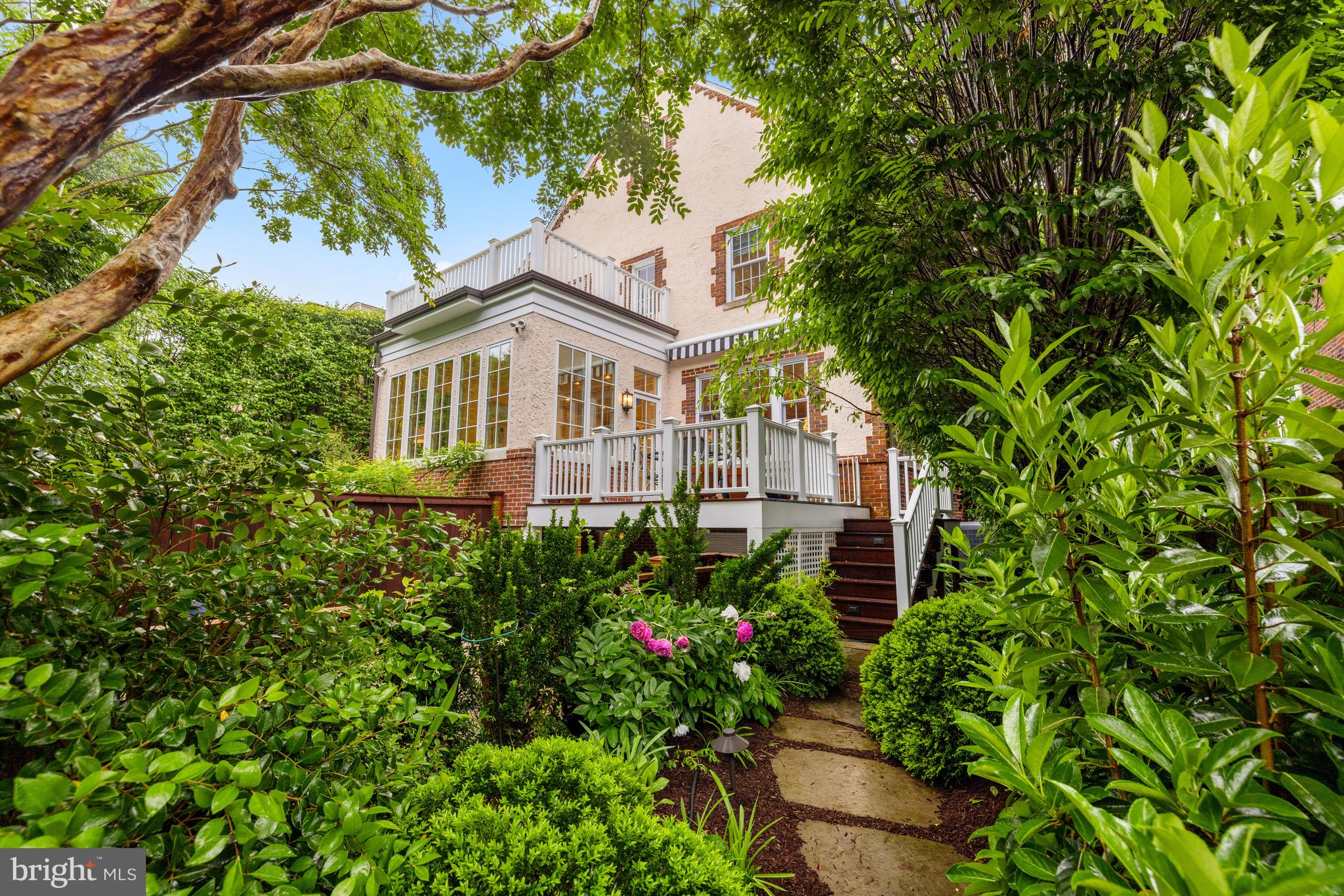 3013 Cathedral Avenue Northwest Washington, DC 20008 - Photo 32 of 33 a front view of a house with a garden
