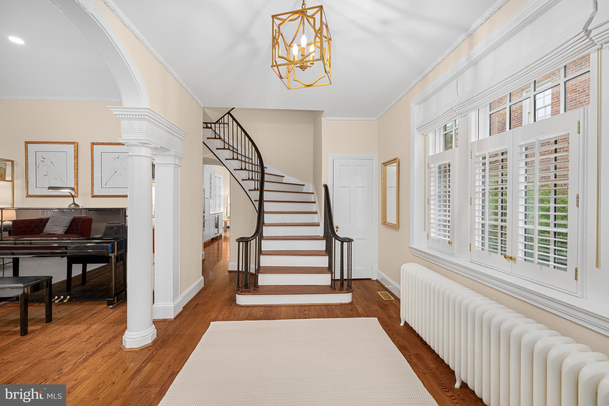 3013 Cathedral Avenue Northwest Washington, DC 20008 - Photo 4 of 33 a view of entryway with stairs and wooden floor
