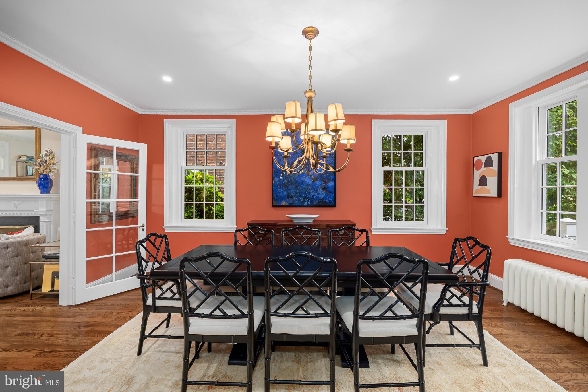 3013 Cathedral Avenue Northwest Washington, DC 20008 - Photo 9 of 33 a dining room with furniture a chandelier and wooden floor