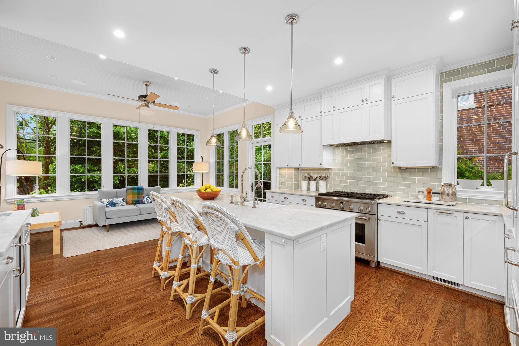 3013 Cathedral Avenue Northwest Washington, DC 20008 - Photo 10 of 33 a large kitchen with kitchen island a large island in it