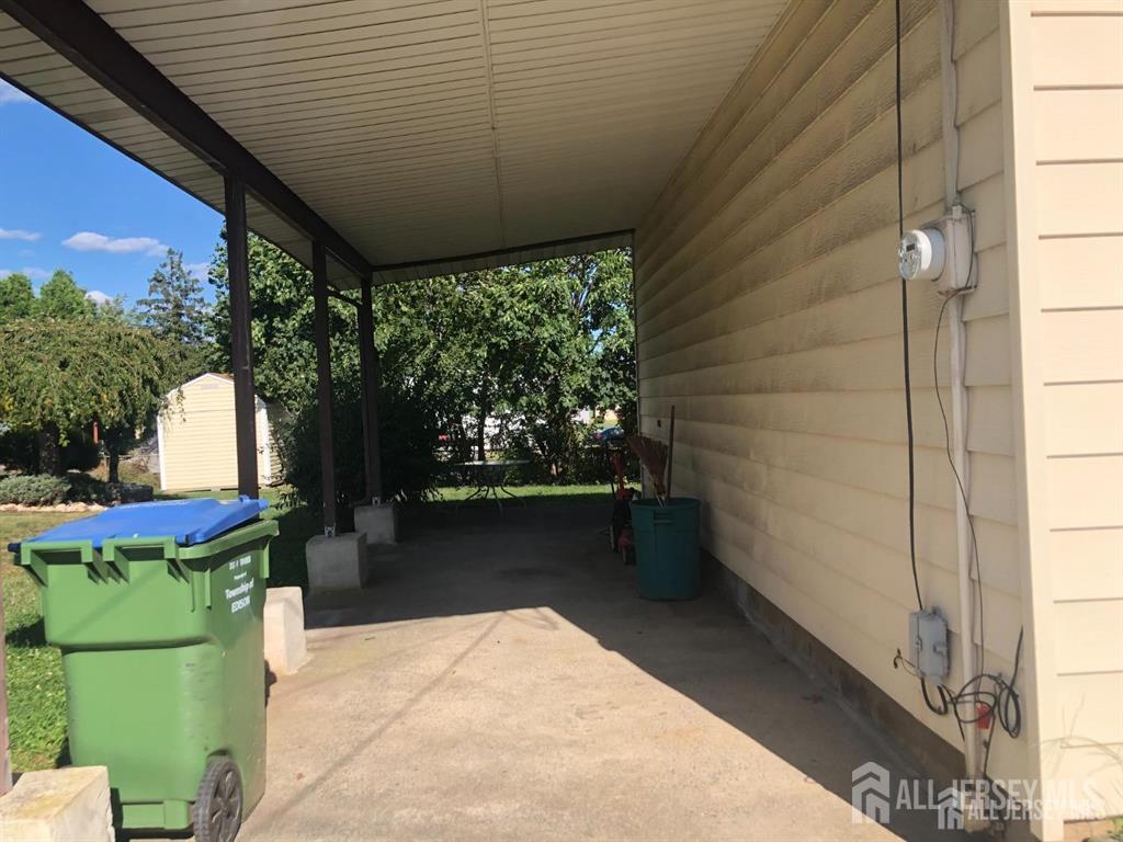 27 Mill Road Edison, NJ 08817 - Photo 15 of 17 a backyard of a house with fountain table and chairs