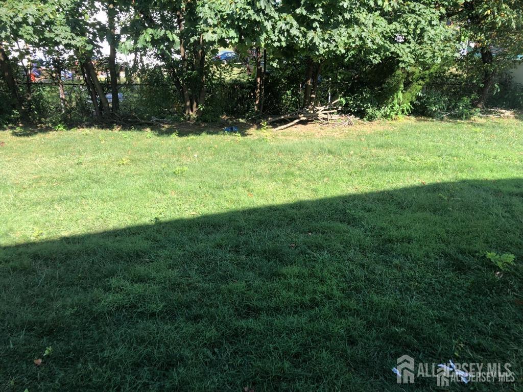 27 Mill Road Edison, NJ 08817 - Photo 16 of 17 a view of outdoor space with deck and yard