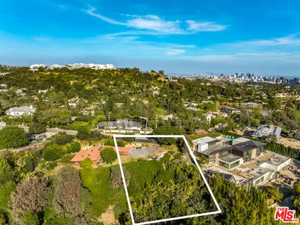 a swimming pool with outdoor seating and yard