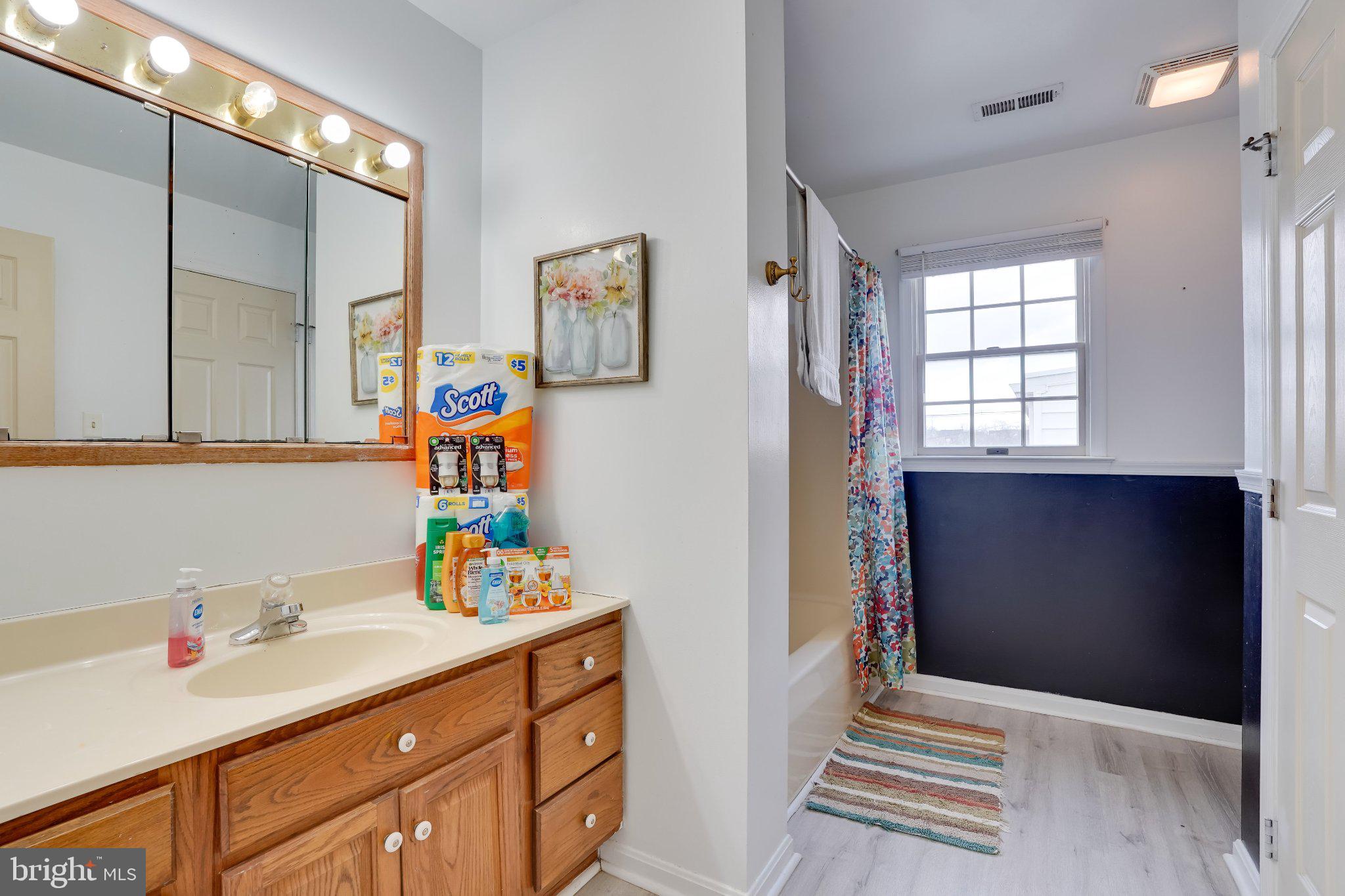 713-715 Medway Road Hagerstown, MD 21740 - Photo 12 of 43 a hallway with a sink and cabinets