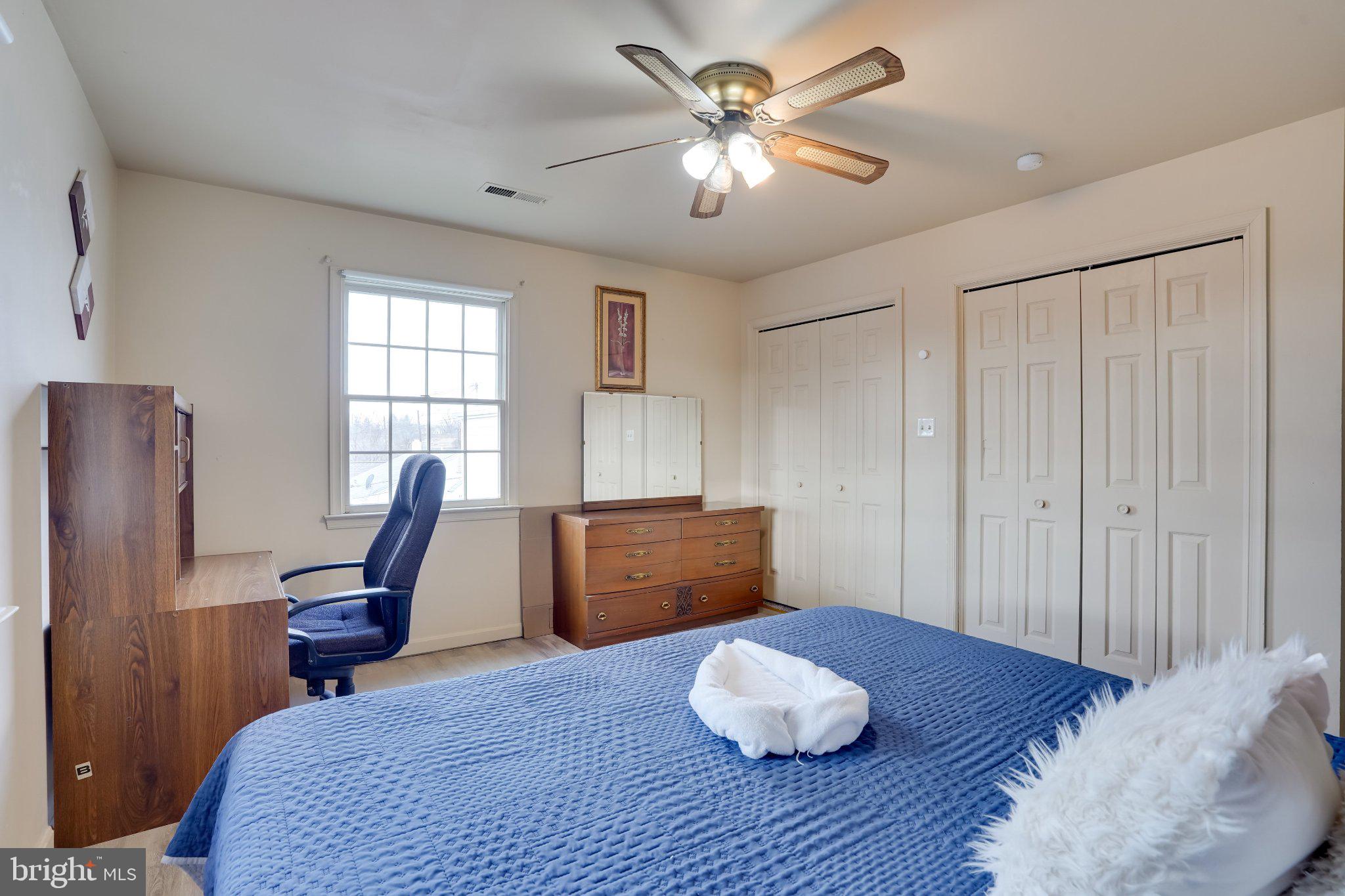 713-715 Medway Road Hagerstown, MD 21740 - Photo 13 of 43 a bedroom with a bed and a chandelier