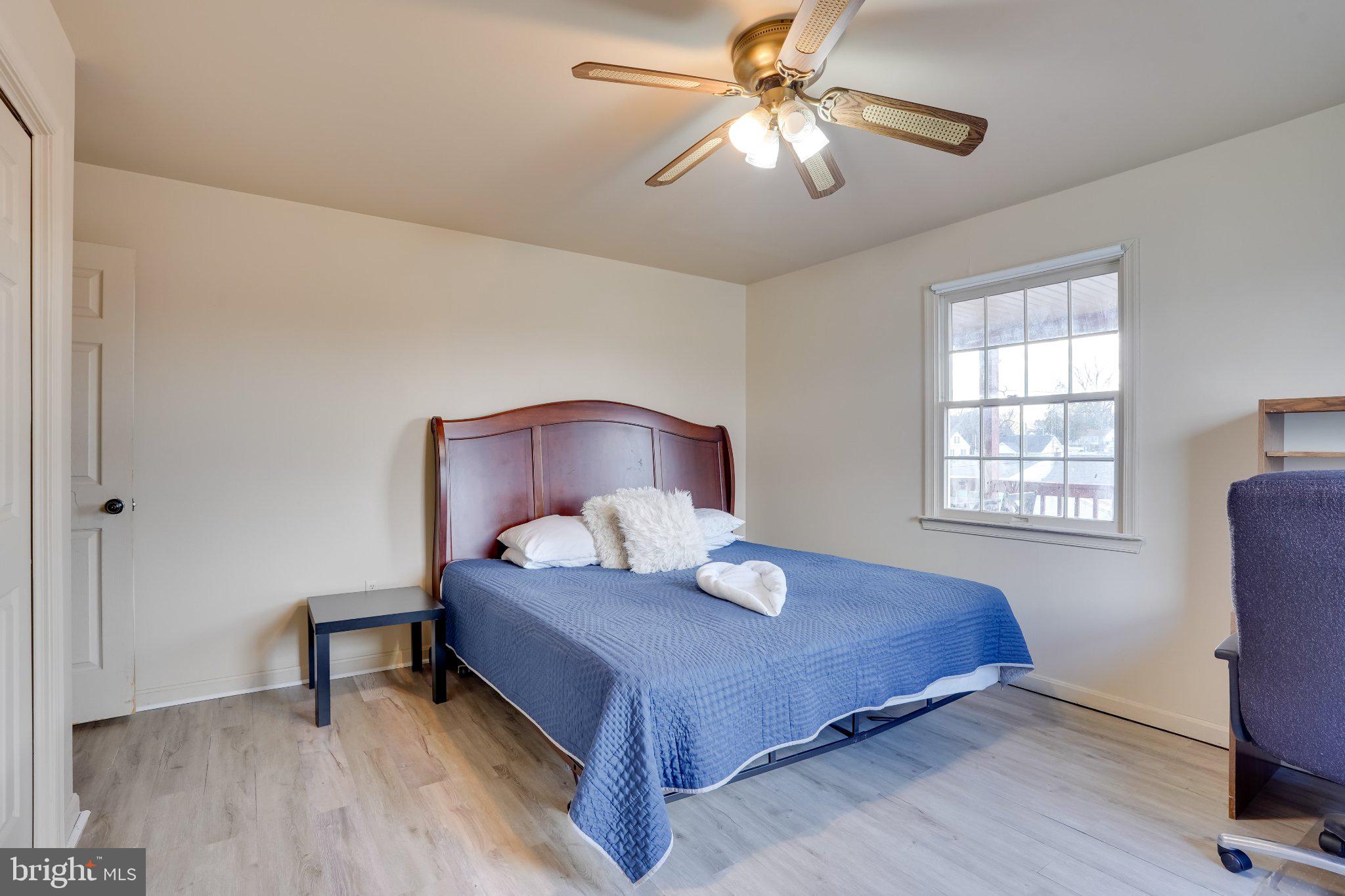 713-715 Medway Road Hagerstown, MD 21740 - Photo 15 of 43 a bedroom with a bed and a chandelier