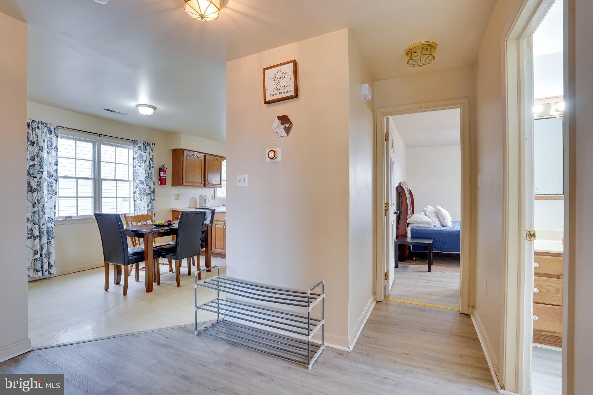 713-715 Medway Road Hagerstown, MD 21740 - Photo 16 of 43 a view of a livingroom and a dining room with furniture window and wooden floor