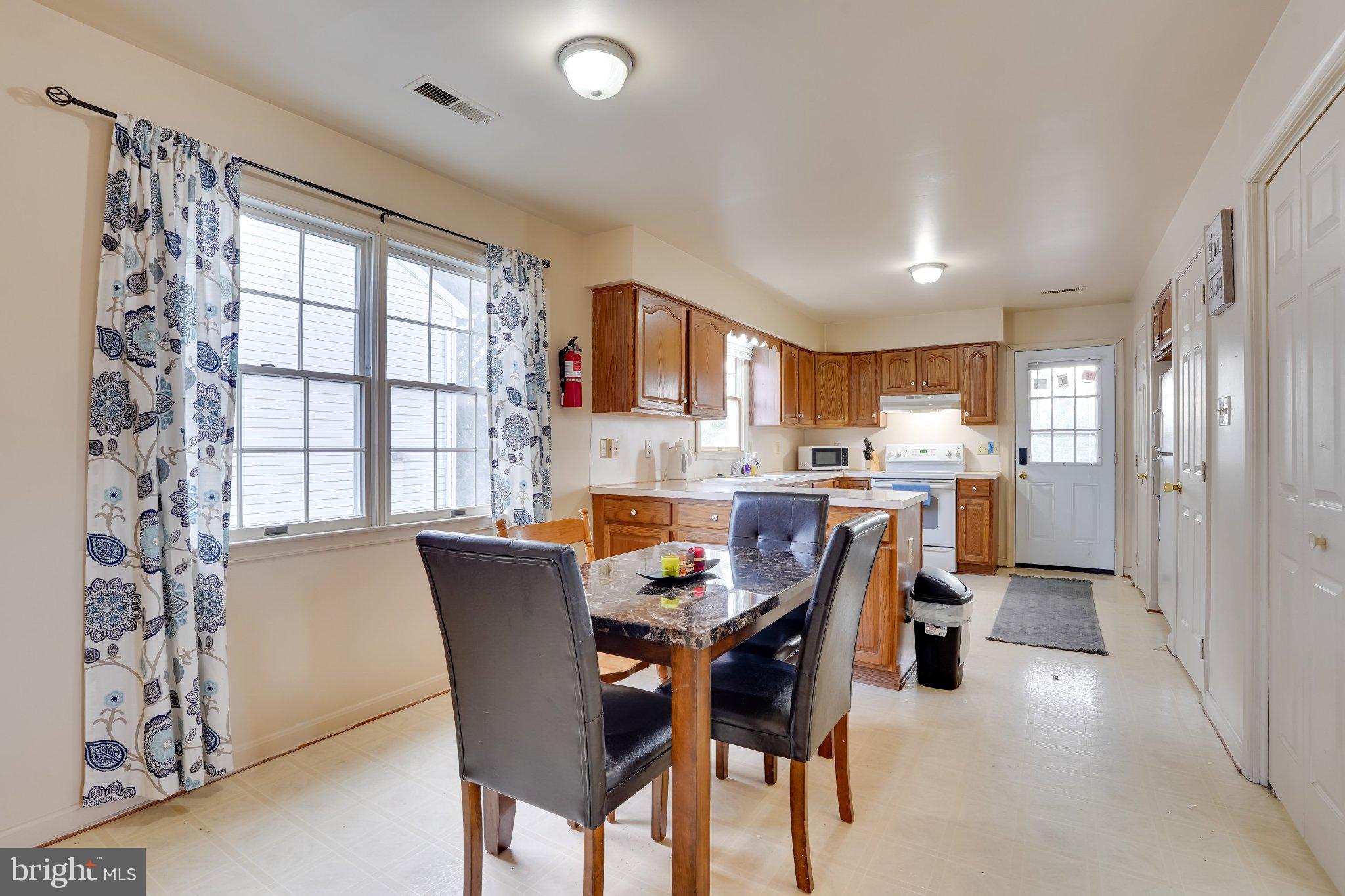 713-715 Medway Road Hagerstown, MD 21740 - Photo 19 of 43 a view of a dining room with furniture and a chandelier