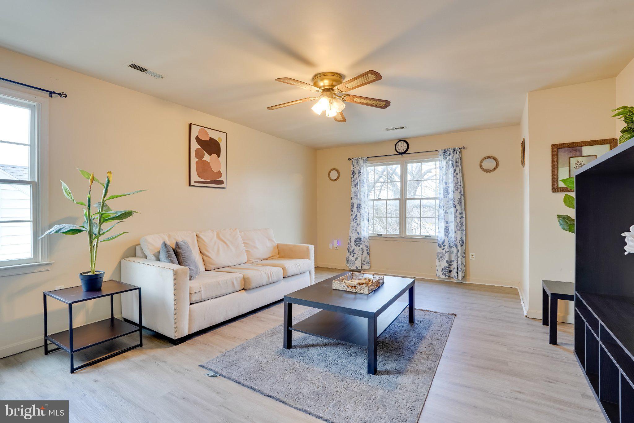713-715 Medway Road Hagerstown, MD 21740 - Photo 24 of 43 a living room with furniture a window and a flat screen tv
