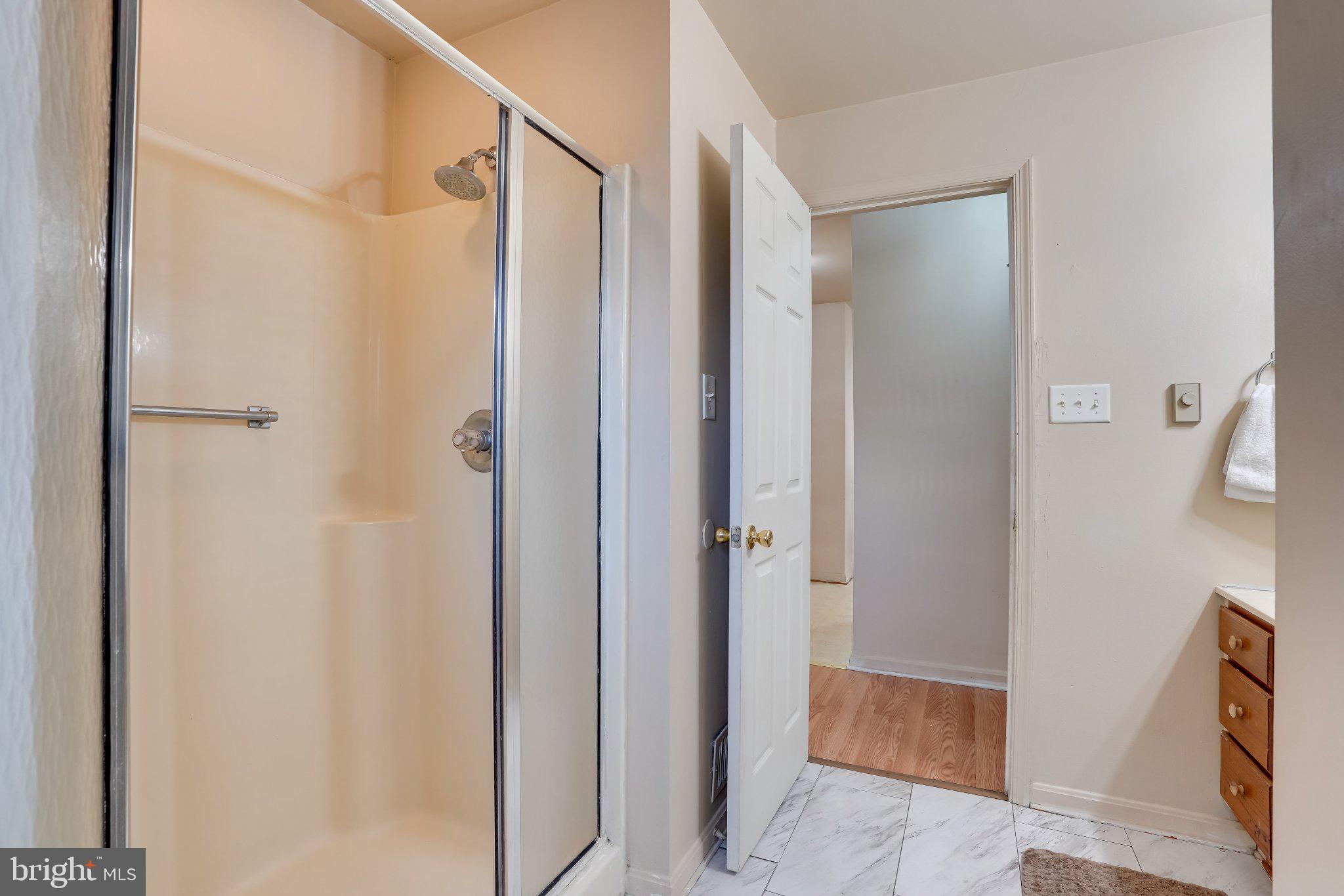 713-715 Medway Road Hagerstown, MD 21740 - Photo 33 of 43 a bathroom with a glass shower door