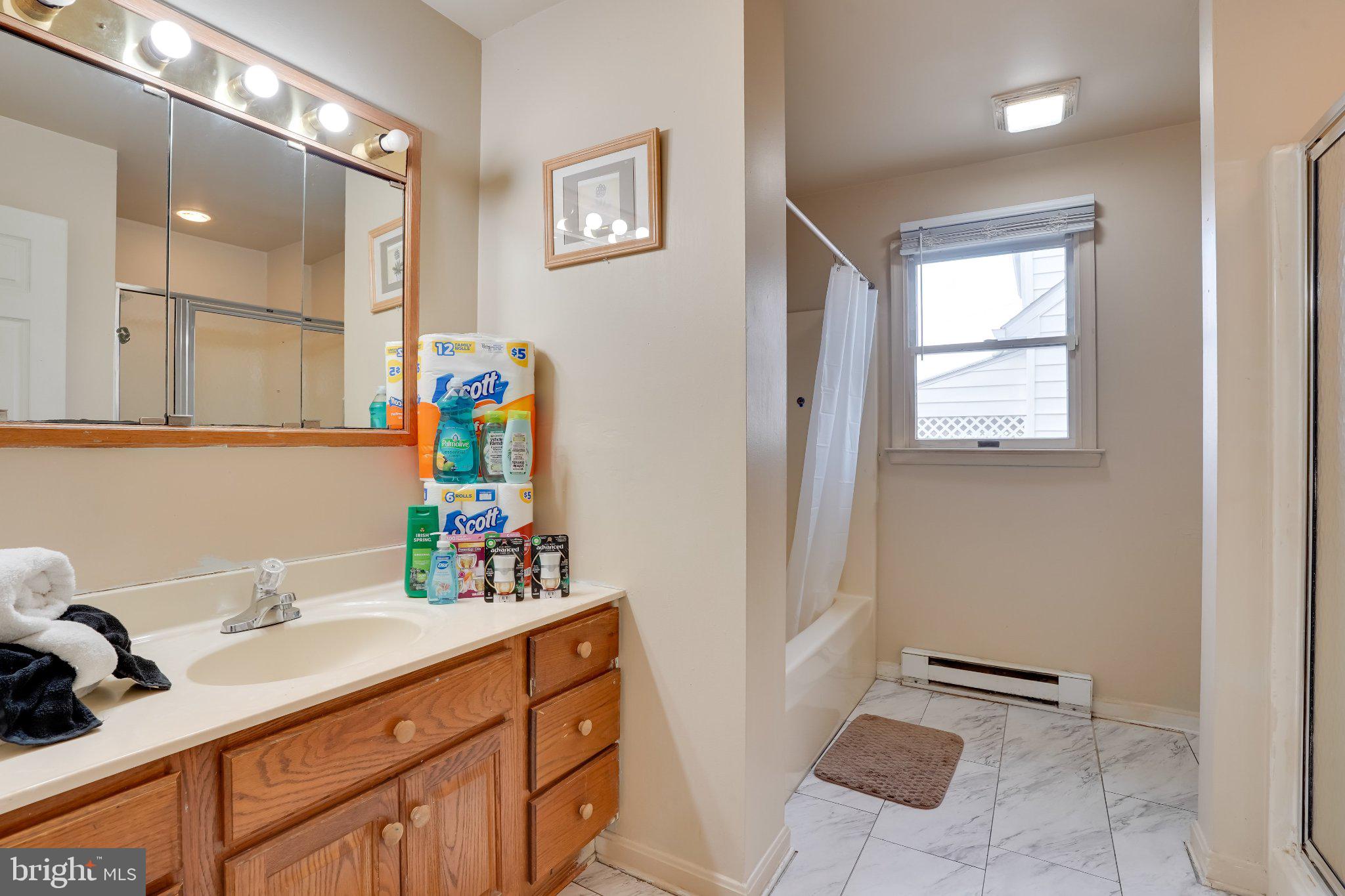 713-715 Medway Road Hagerstown, MD 21740 - Photo 34 of 43 a bathroom with a sink and a mirror
