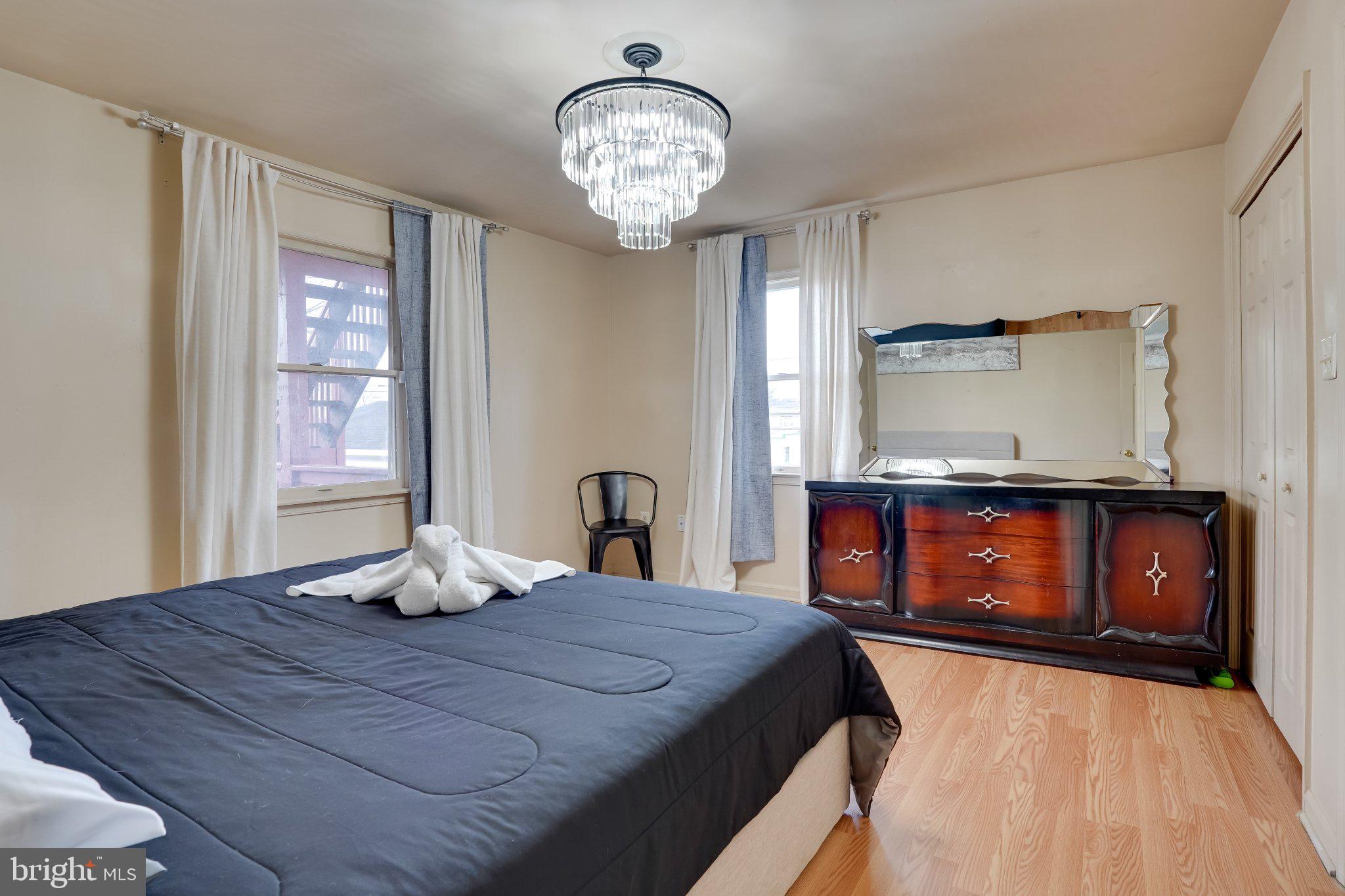 713-715 Medway Road Hagerstown, MD 21740 - Photo 35 of 43 a bedroom with a bed and dresser with mirror