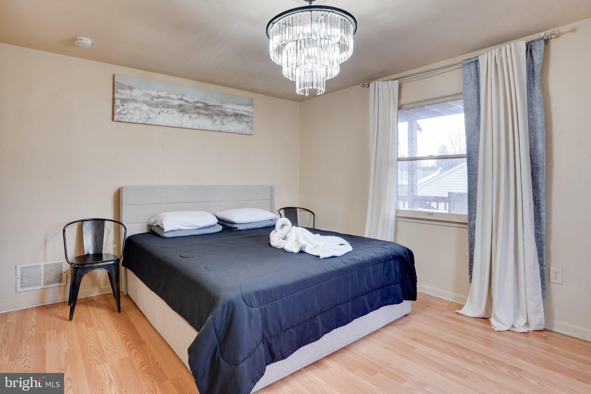 713-715 Medway Road Hagerstown, MD 21740 - Photo 36 of 43 a bedroom with a bed and a table