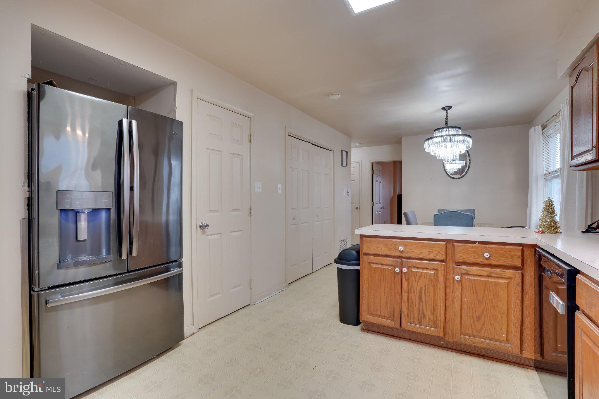 713-715 Medway Road Hagerstown, MD 21740 - Photo 38 of 43 a kitchen with stainless steel appliances granite countertop a refrigerator a sink and white cabinets