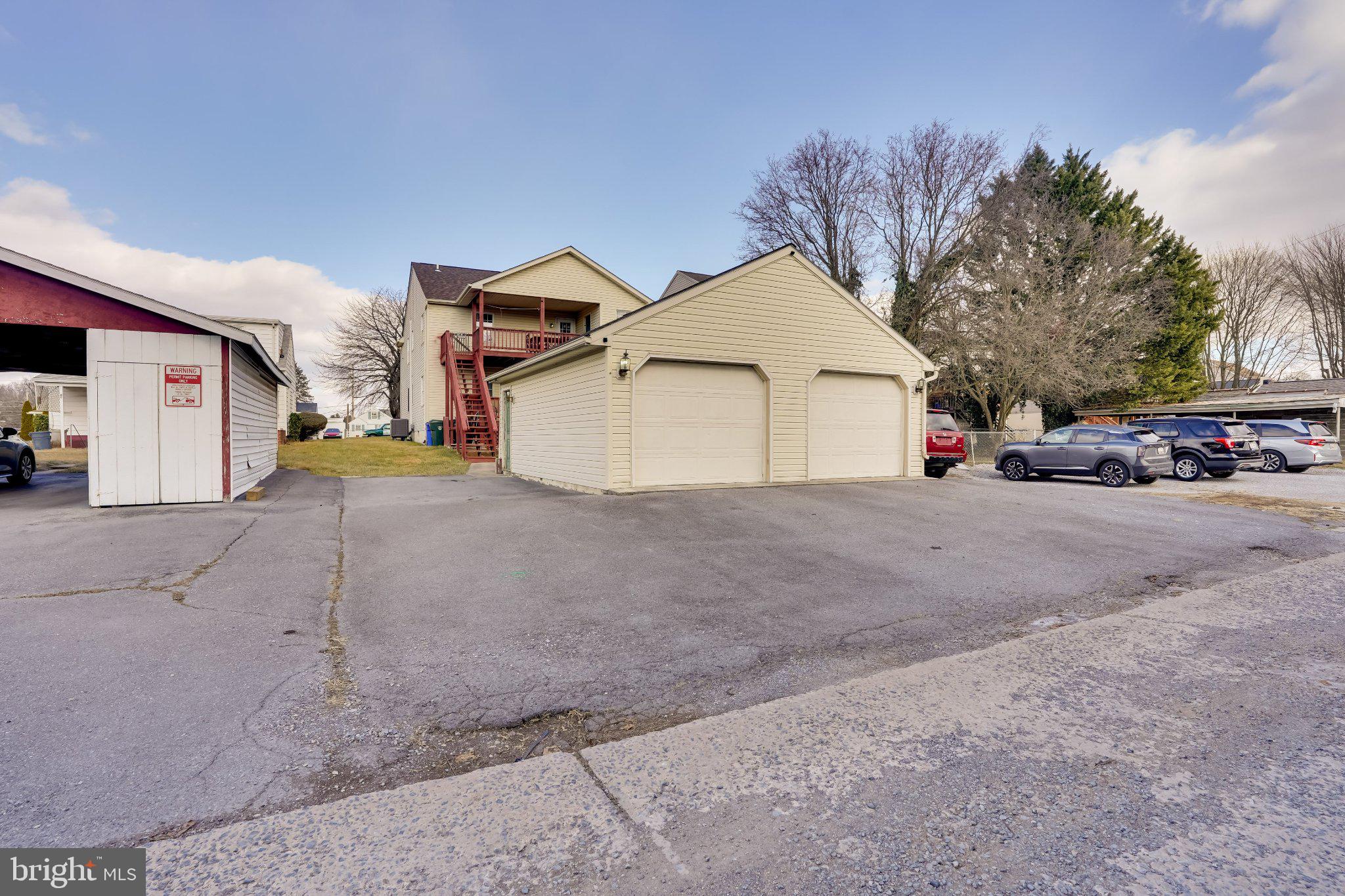 713-715 Medway Road Hagerstown, MD 21740 - Photo 4 of 43 a view of a white house with a street