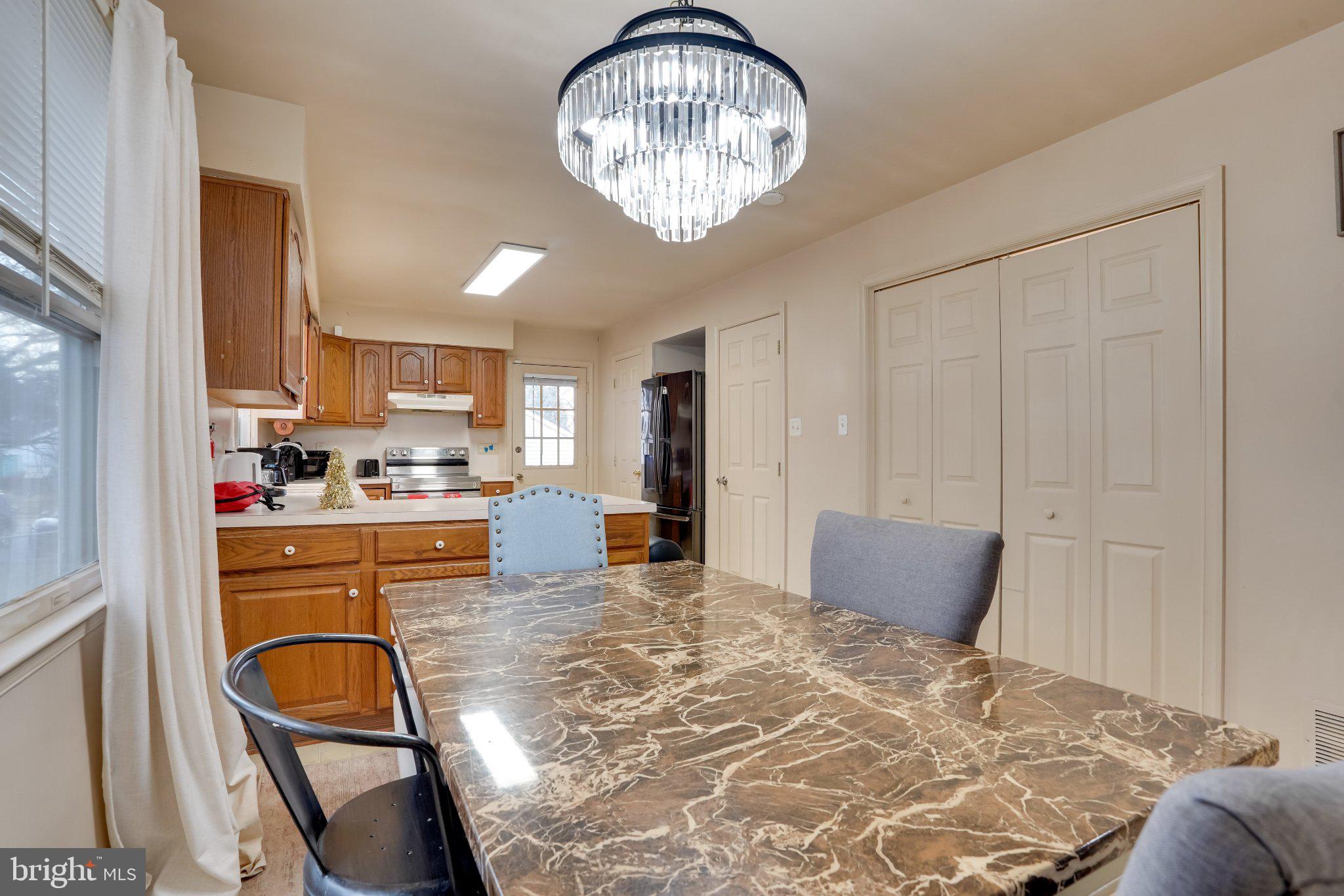 713-715 Medway Road Hagerstown, MD 21740 - Photo 41 of 43 a kitchen with stainless steel appliances granite countertop a stove refrigerator and cabinets