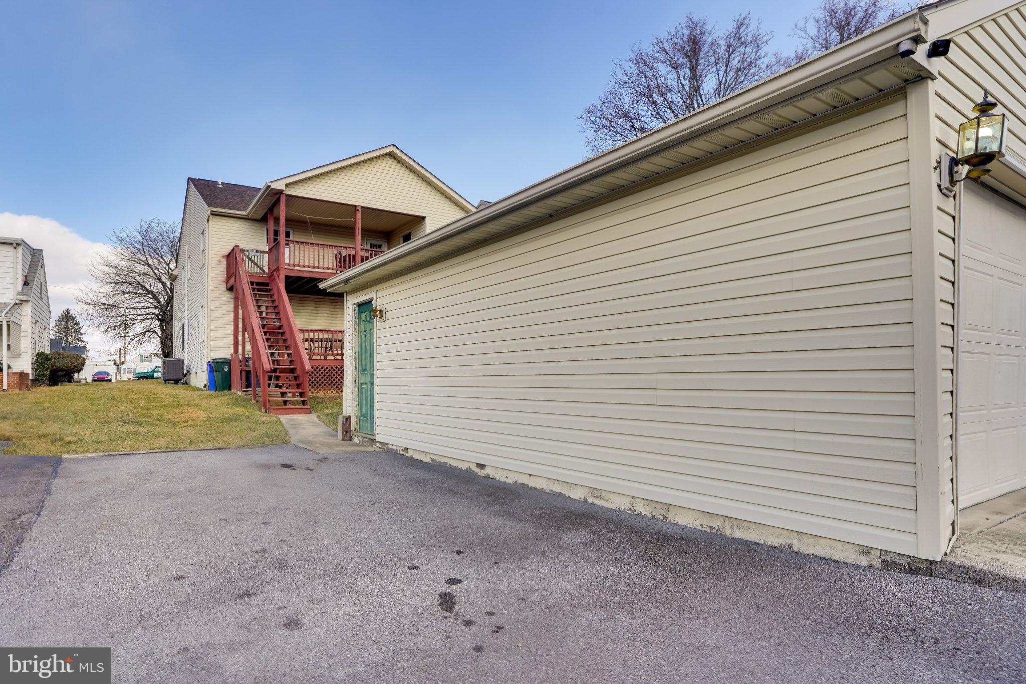713-715 Medway Road Hagerstown, MD 21740 - Photo 5 of 43 a view of a house with a yard and garage