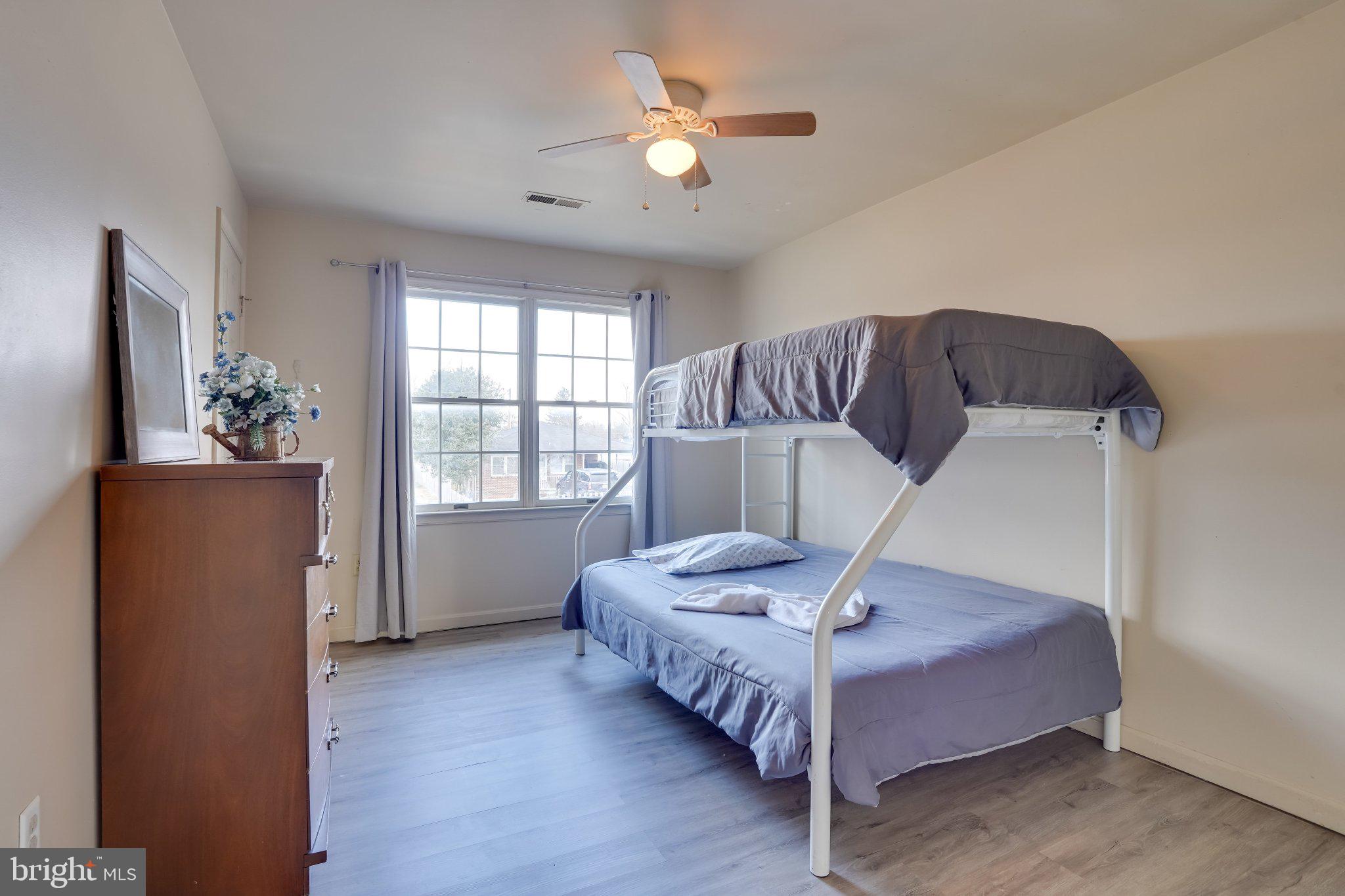 713-715 Medway Road Hagerstown, MD 21740 - Photo 10 of 43 a spacious bedroom with a bed and a chandelier