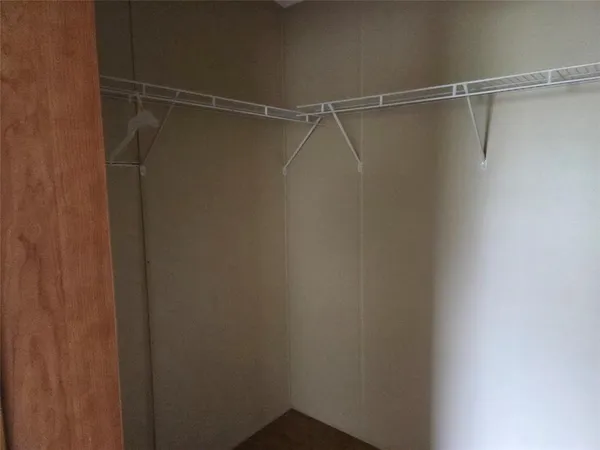 a view of a room with racks on the wall