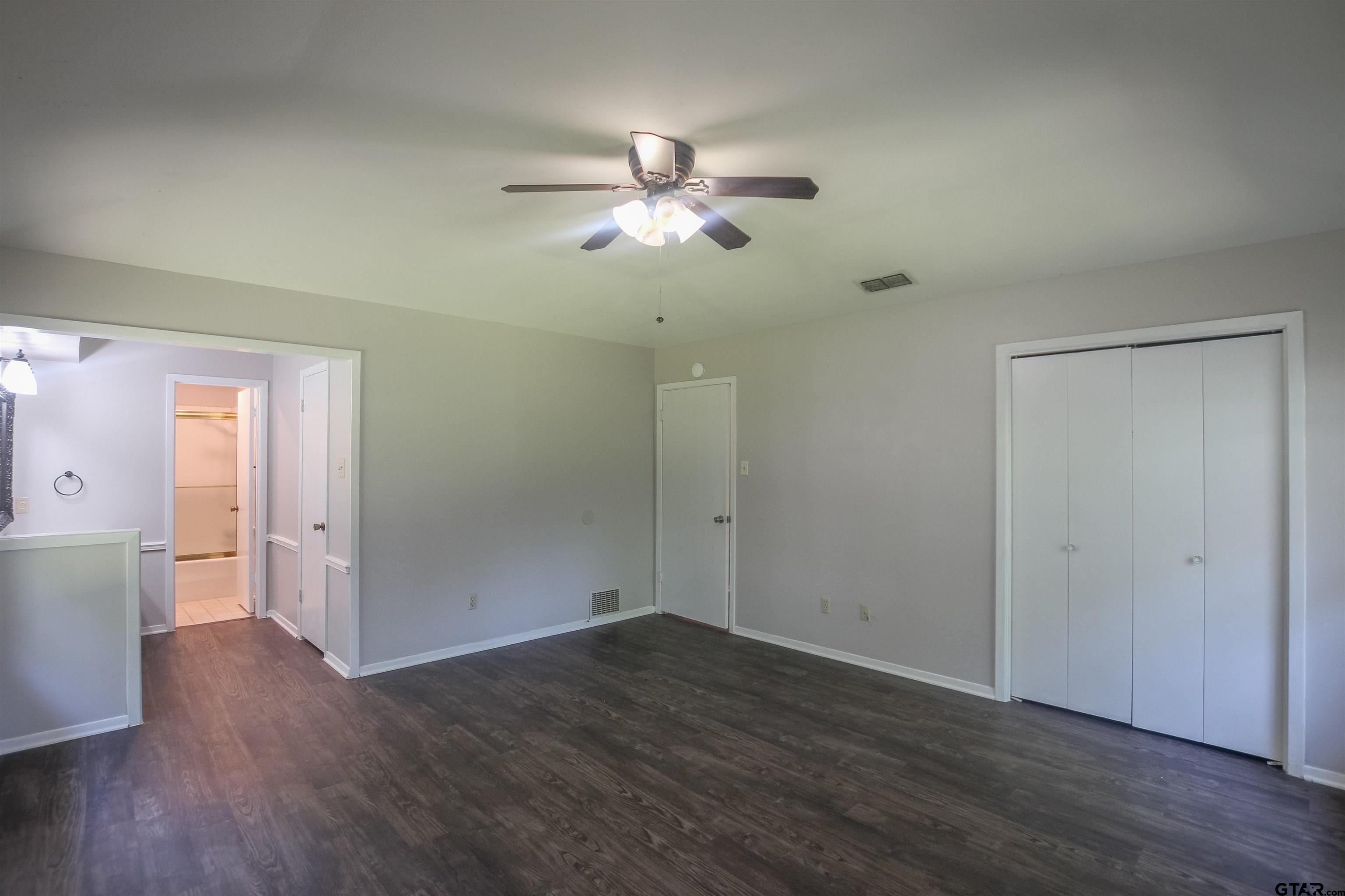 8524 Radcliffe Drive Tyler, TX 75703 - Photo 14 of 26 a view of empty room with wooden floor