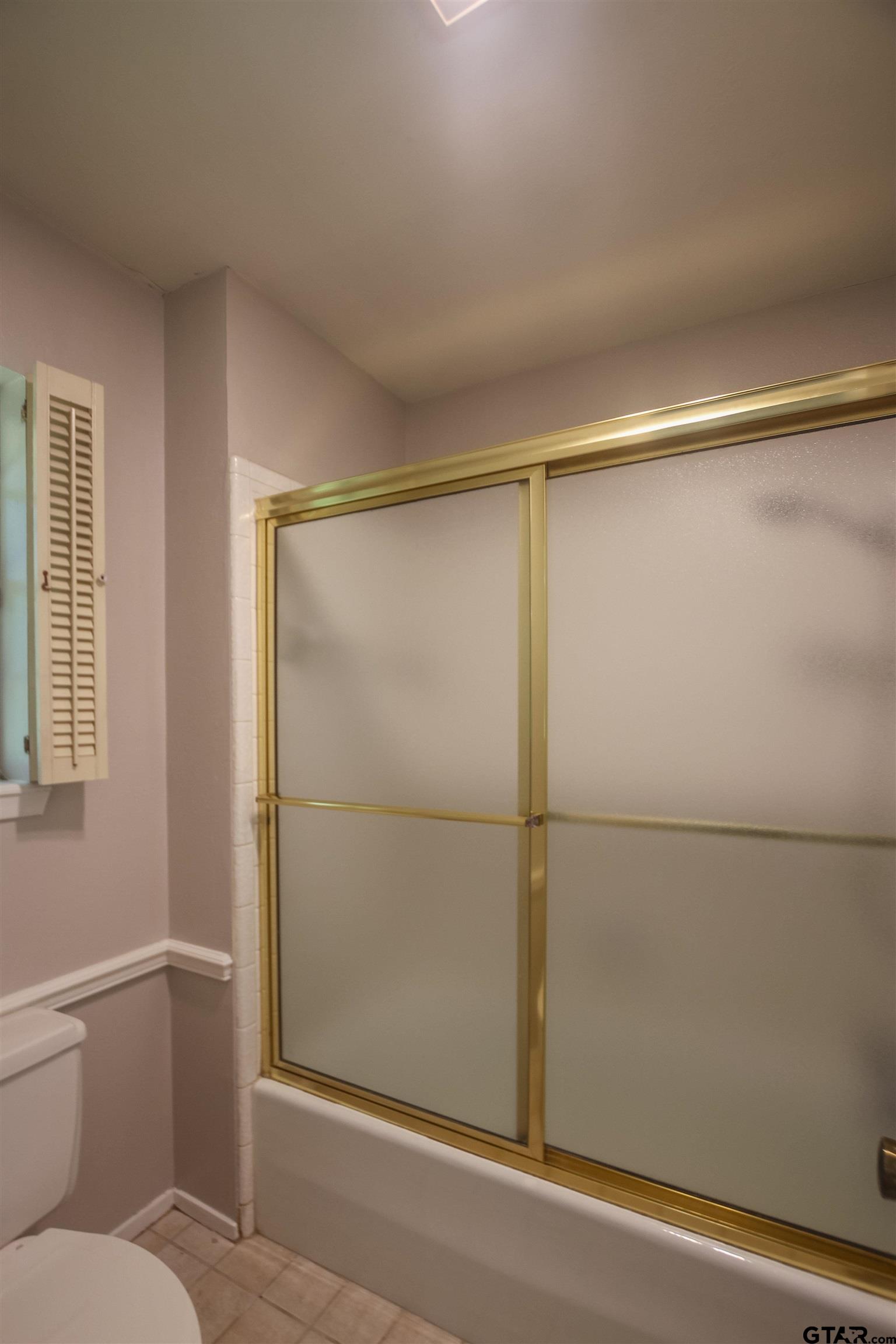 8524 Radcliffe Drive Tyler, TX 75703 - Photo 17 of 26 a bathroom with a shower