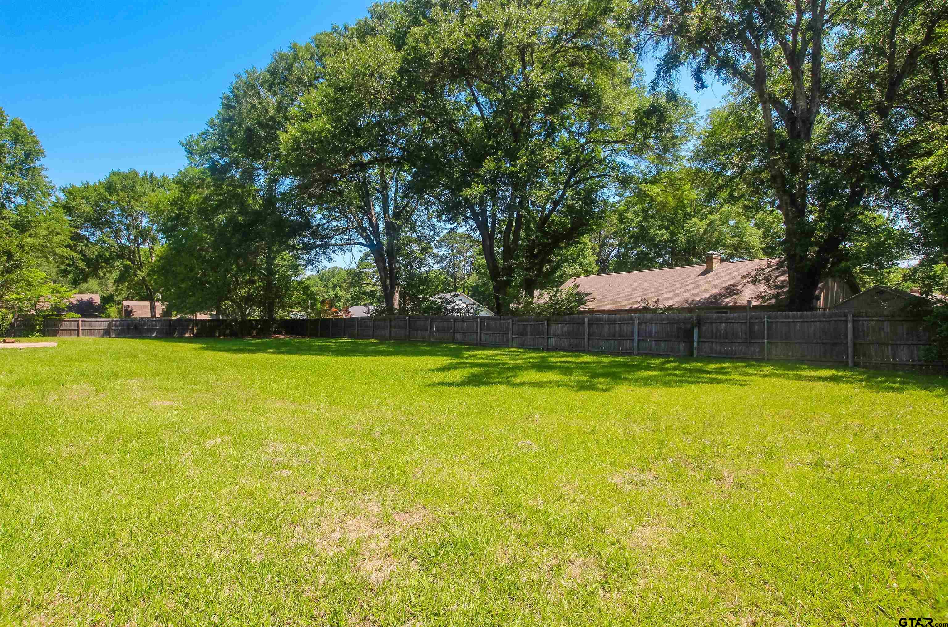 8524 Radcliffe Drive Tyler, TX 75703 - Photo 25 of 26 a view of a swimming pool with an outdoor space and seating area