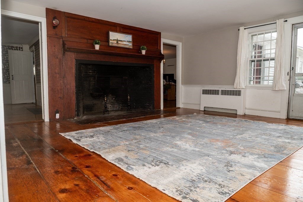 167 Elm Street Hanover, MA 02339 - Photo 11 of 26 a living room with a fireplace