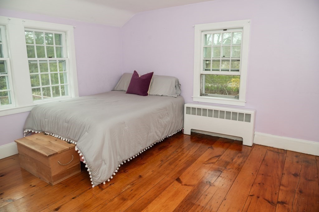 167 Elm Street Hanover, MA 02339 - Photo 13 of 26 a bedroom with a bed and a window