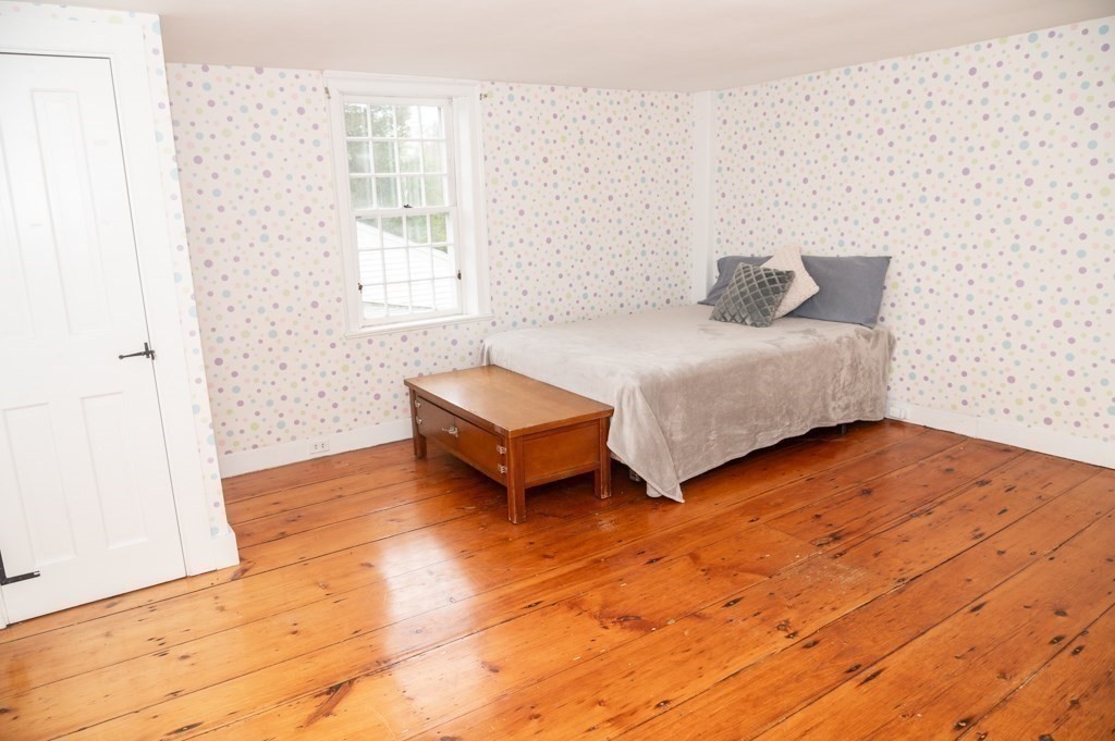 167 Elm Street Hanover, MA 02339 - Photo 15 of 26 a bedroom with a bed and a window