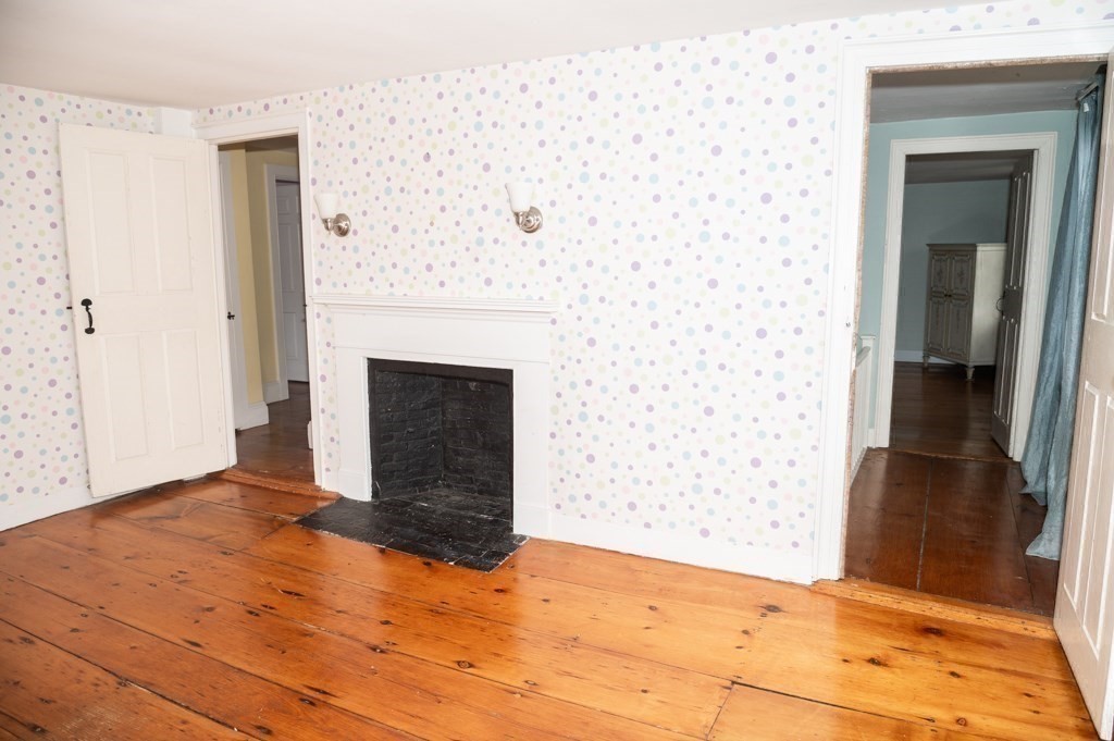 167 Elm Street Hanover, MA 02339 - Photo 16 of 26 a view of empty room with wooden floor