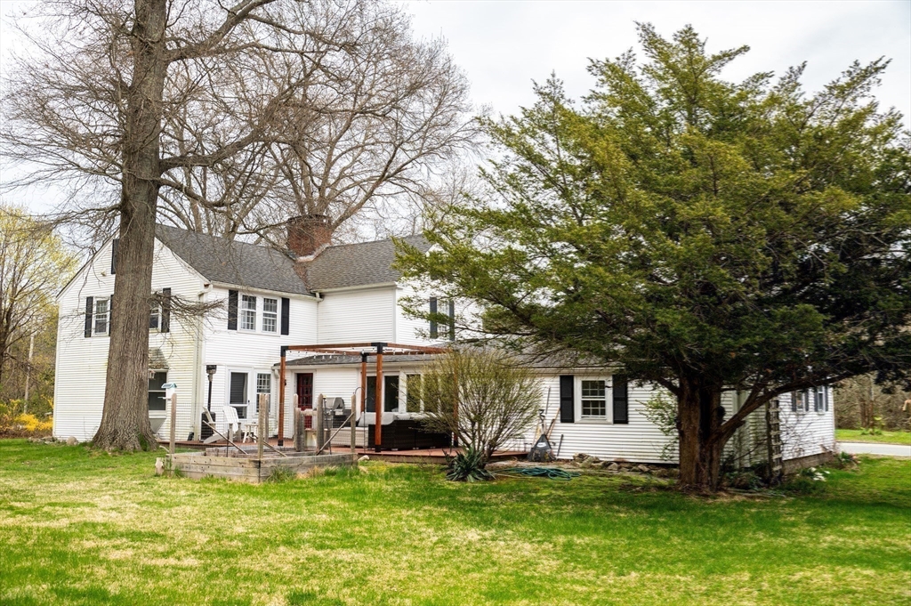 167 Elm Street Hanover, MA 02339 - Photo 22 of 26 a view of a house with a yard patio and fire pit