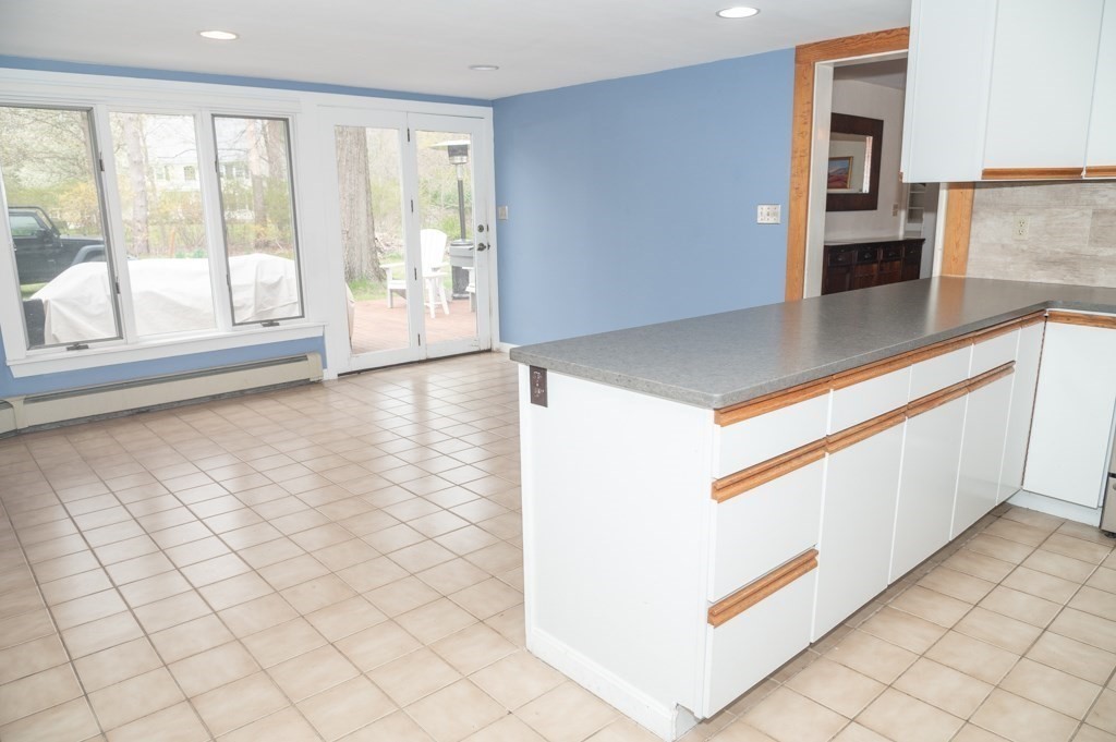 167 Elm Street Hanover, MA 02339 - Photo 5 of 26 a view of a kitchen cabinets and wooden floor