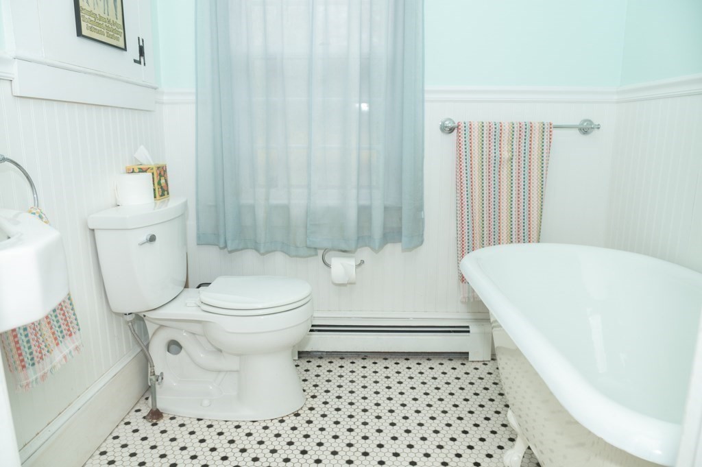 167 Elm Street Hanover, MA 02339 - Photo 10 of 26 a bathroom with a toilet a sink and a shower